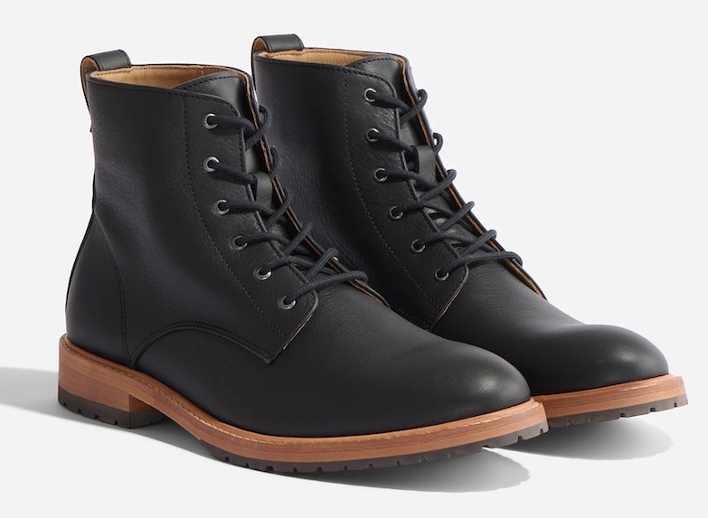 A pair of black leather lace up boots