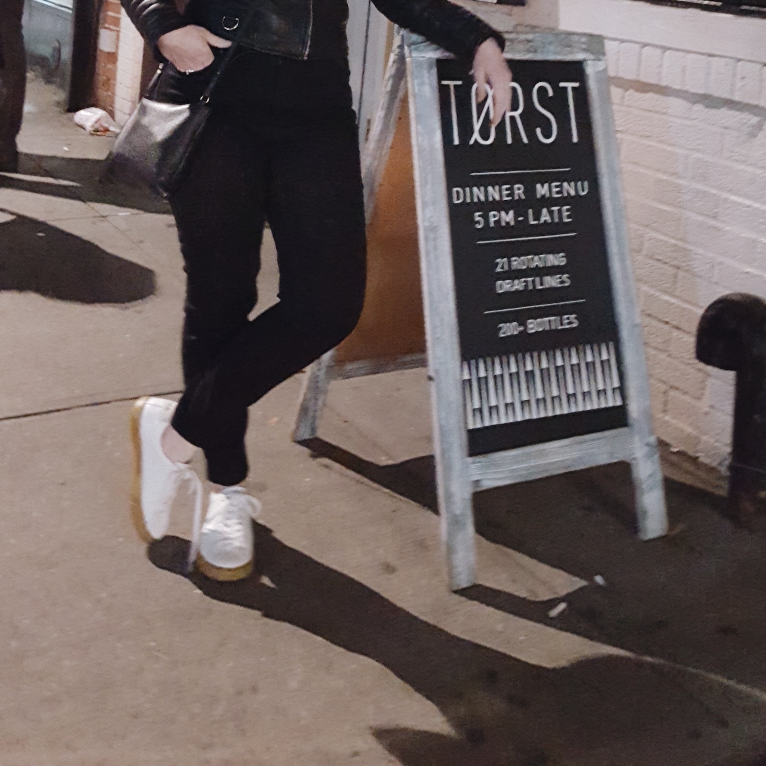 Alyssa stands outside of Torst NYC