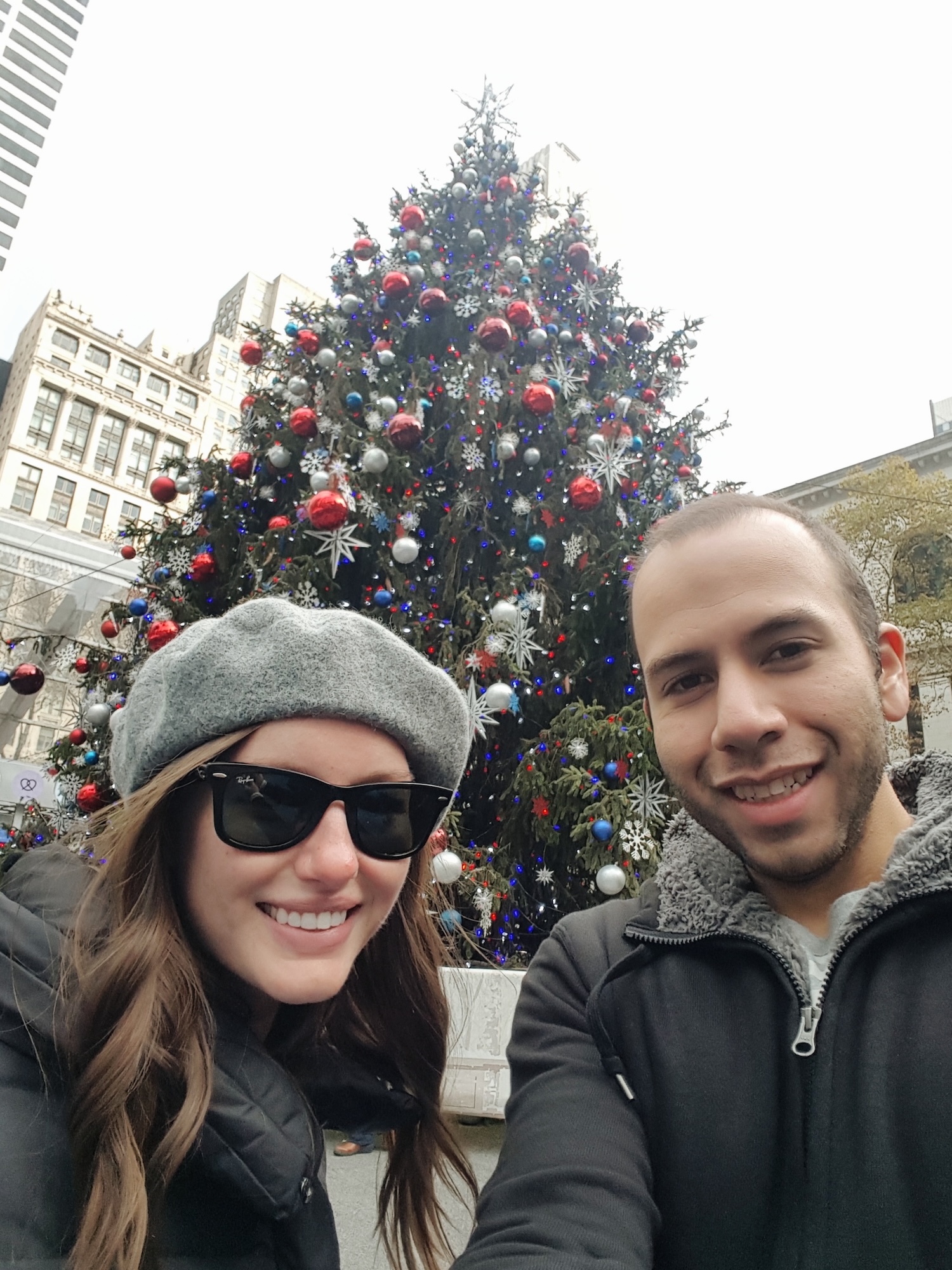 Alyssa and Michael in front of the tree in Bryant Park