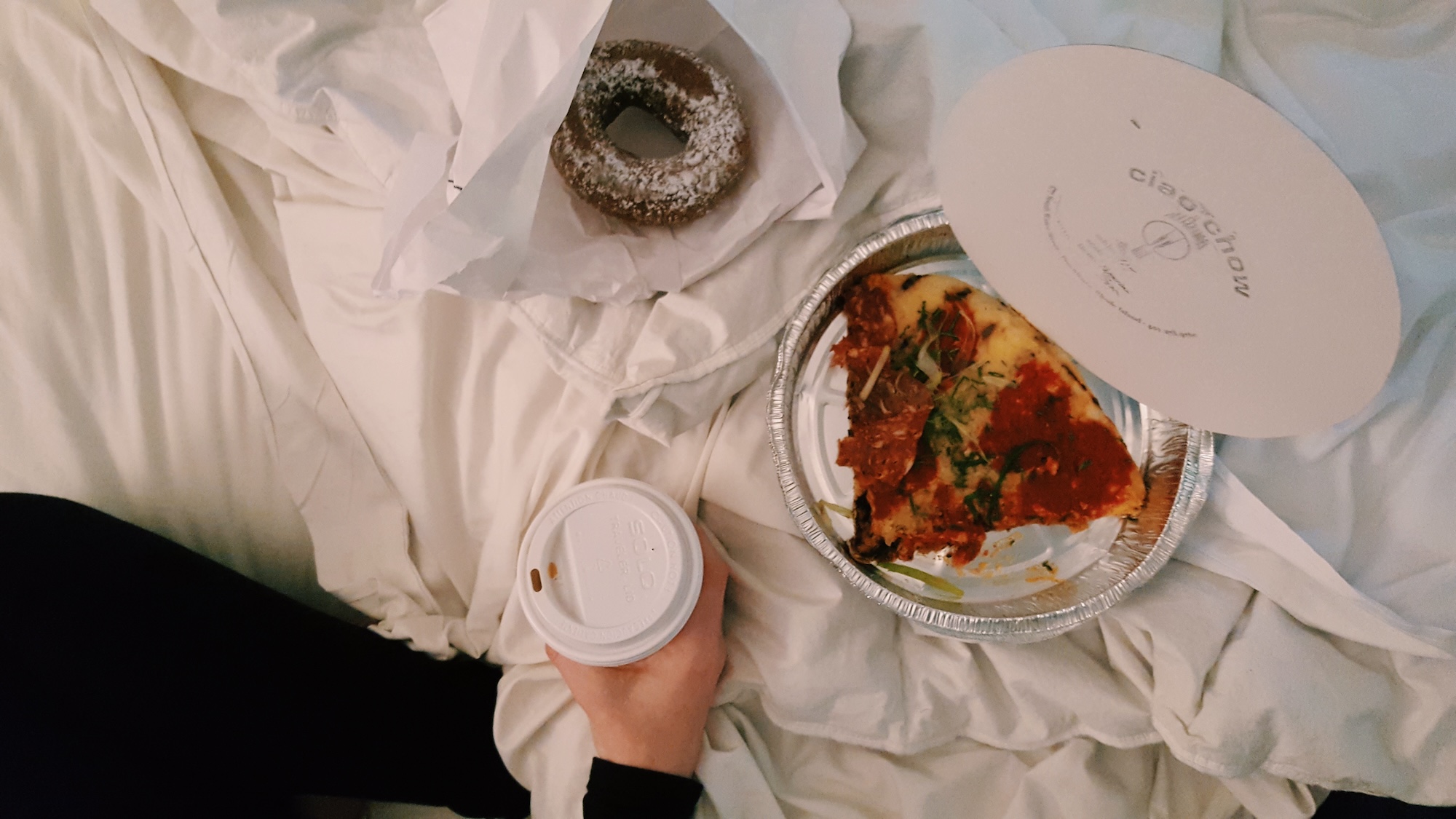 Alyssa eats breakfast in bed in Providence