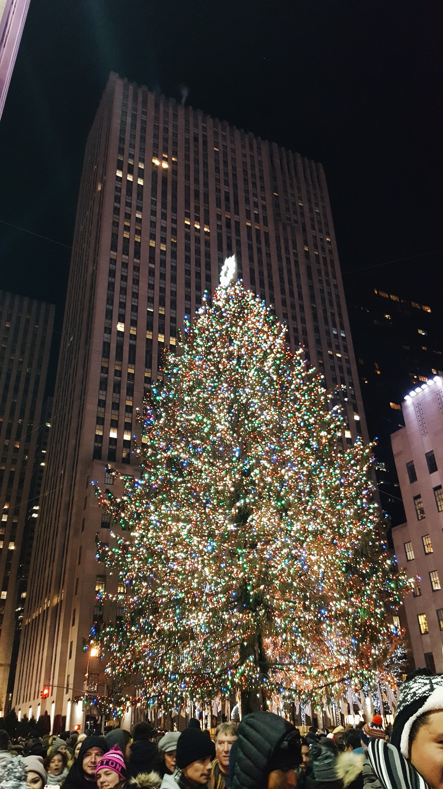 A photo of a crowd gathered at the Rockefeller Tree