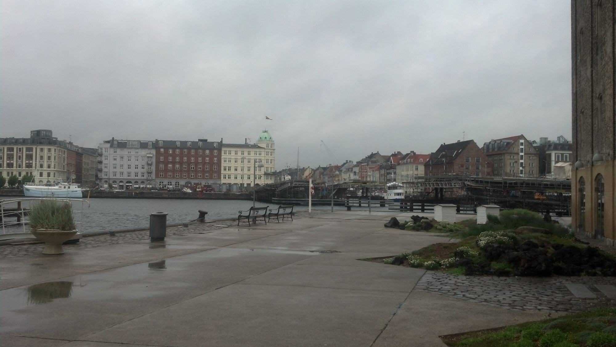 The buildings and harbor surrounding noma Copenhagen