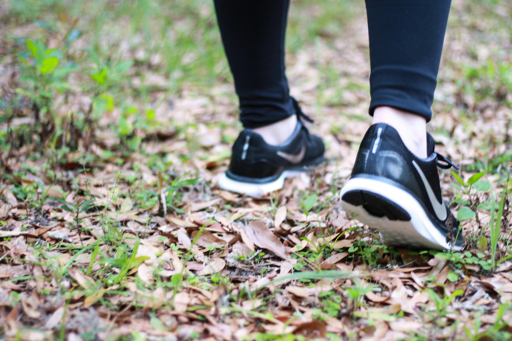 A pair of sneakers on a trail