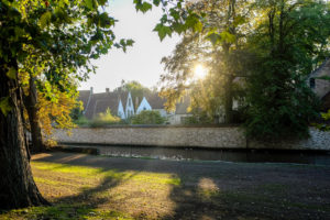 A brick wall along a waterway in Bruges