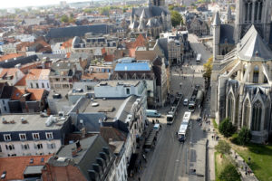 View of trams and city streets below taken from the Ghent Belfry