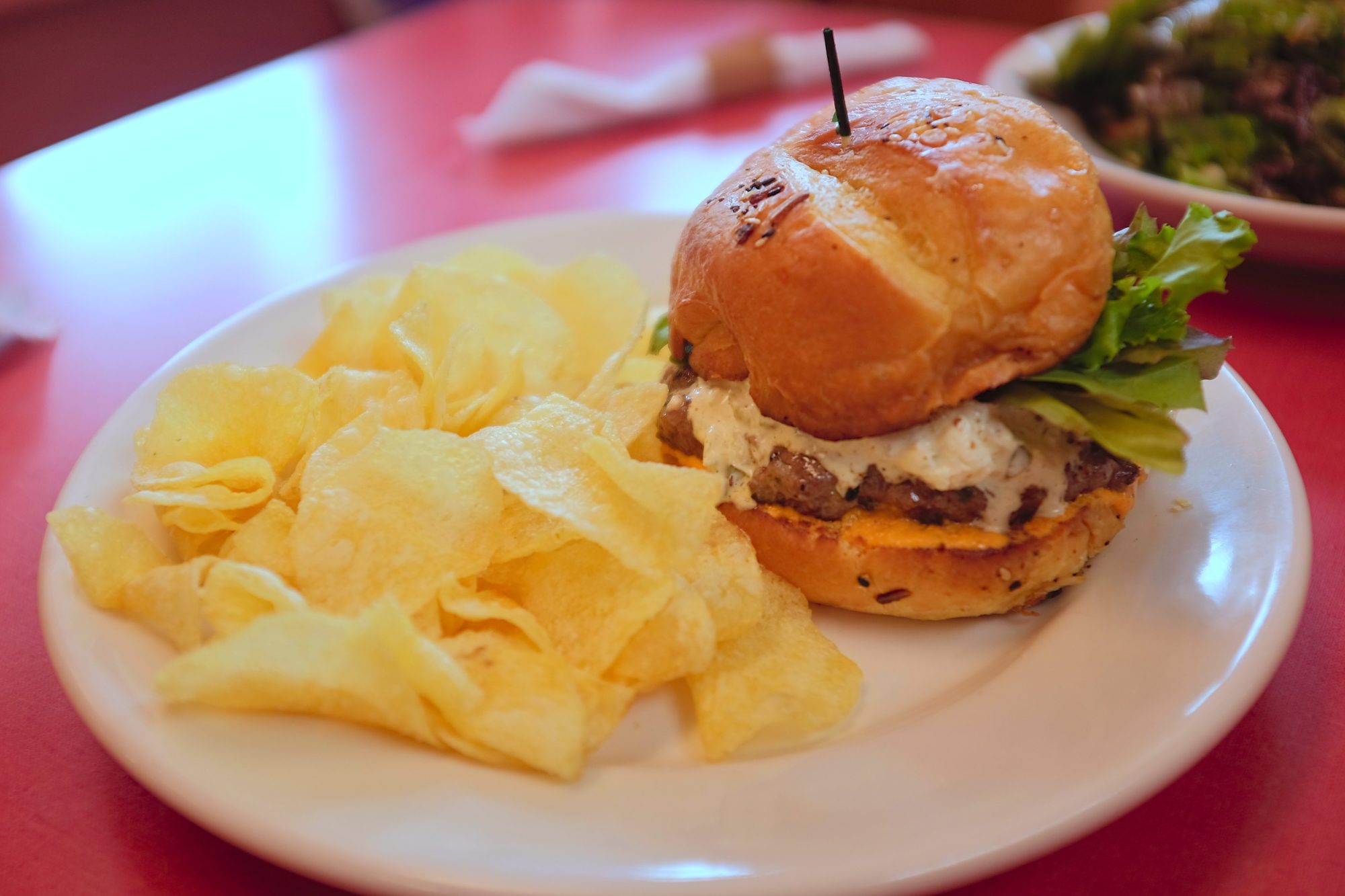 A lamb burger with chips from Lucky Rivers