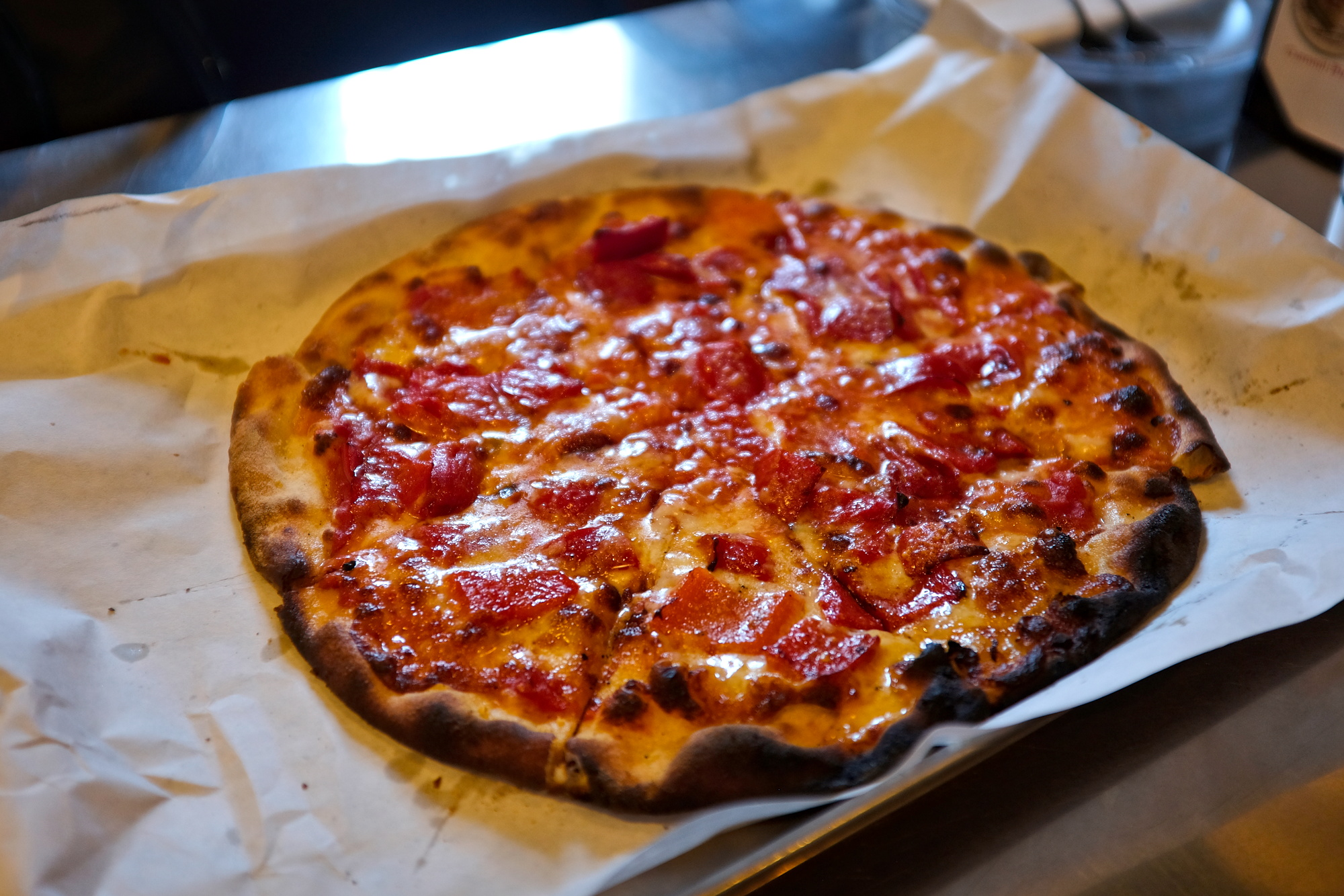 A pizza at Frank Pepe's with roasted red peppers