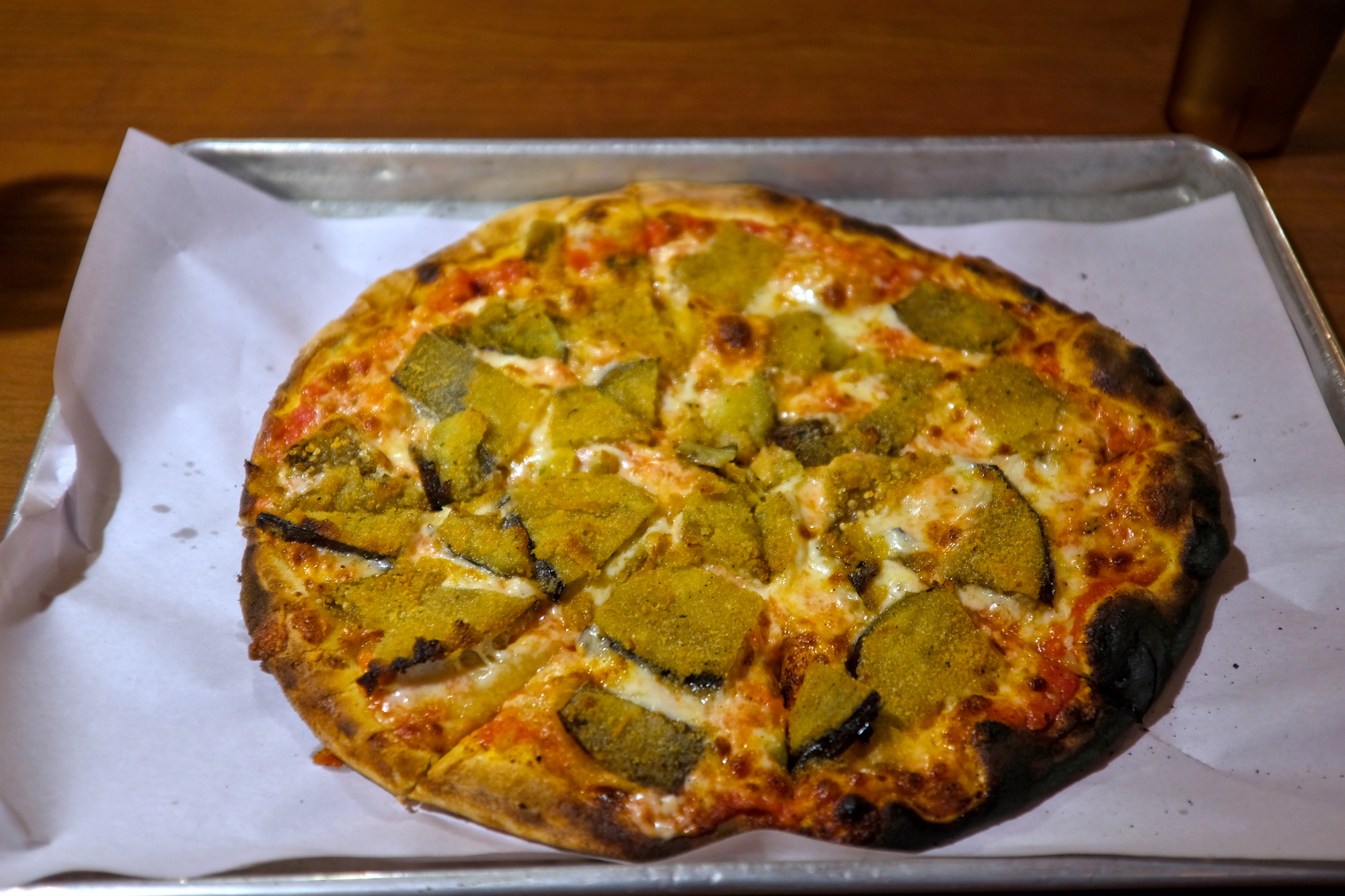 A pizza with fried eggplant