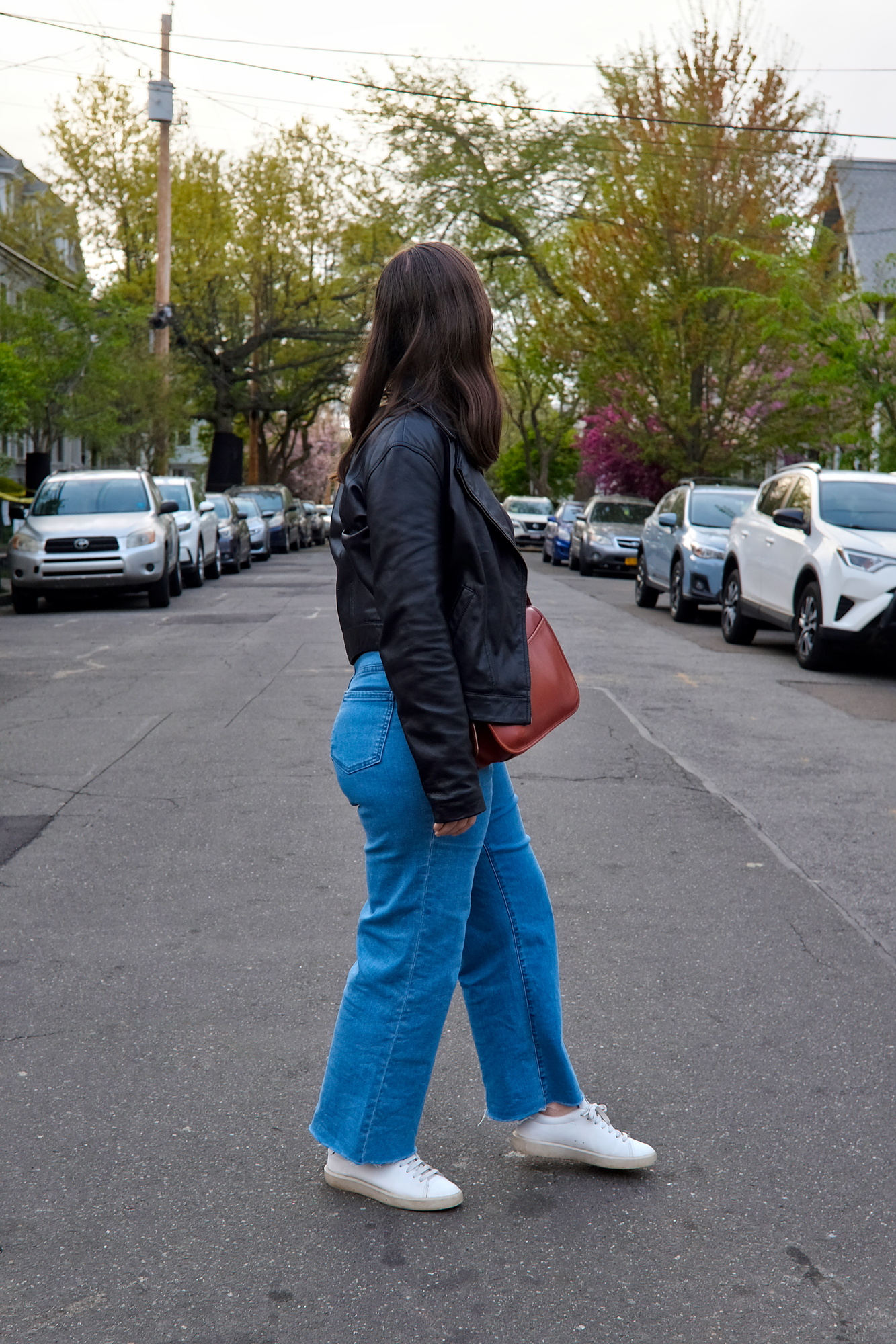 Alyssa looks down a street in New Haven