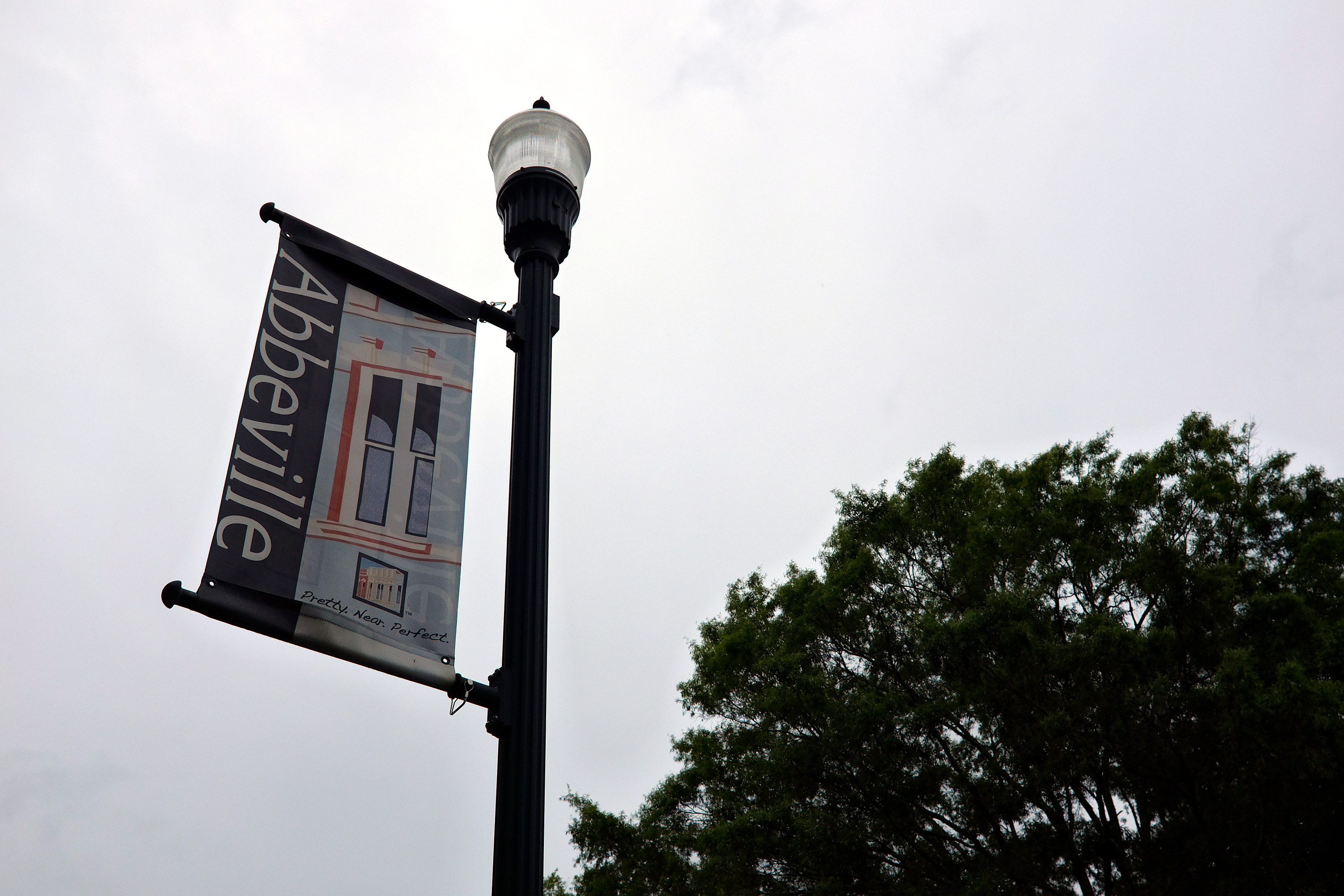 Abbeville sign on a lamp post 