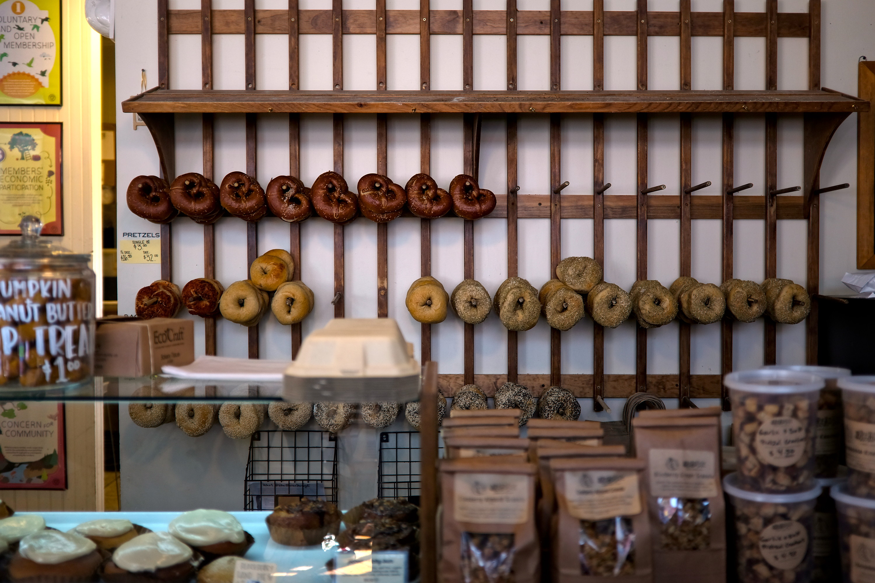 Bagels and pretzels on a wall at BreadHive