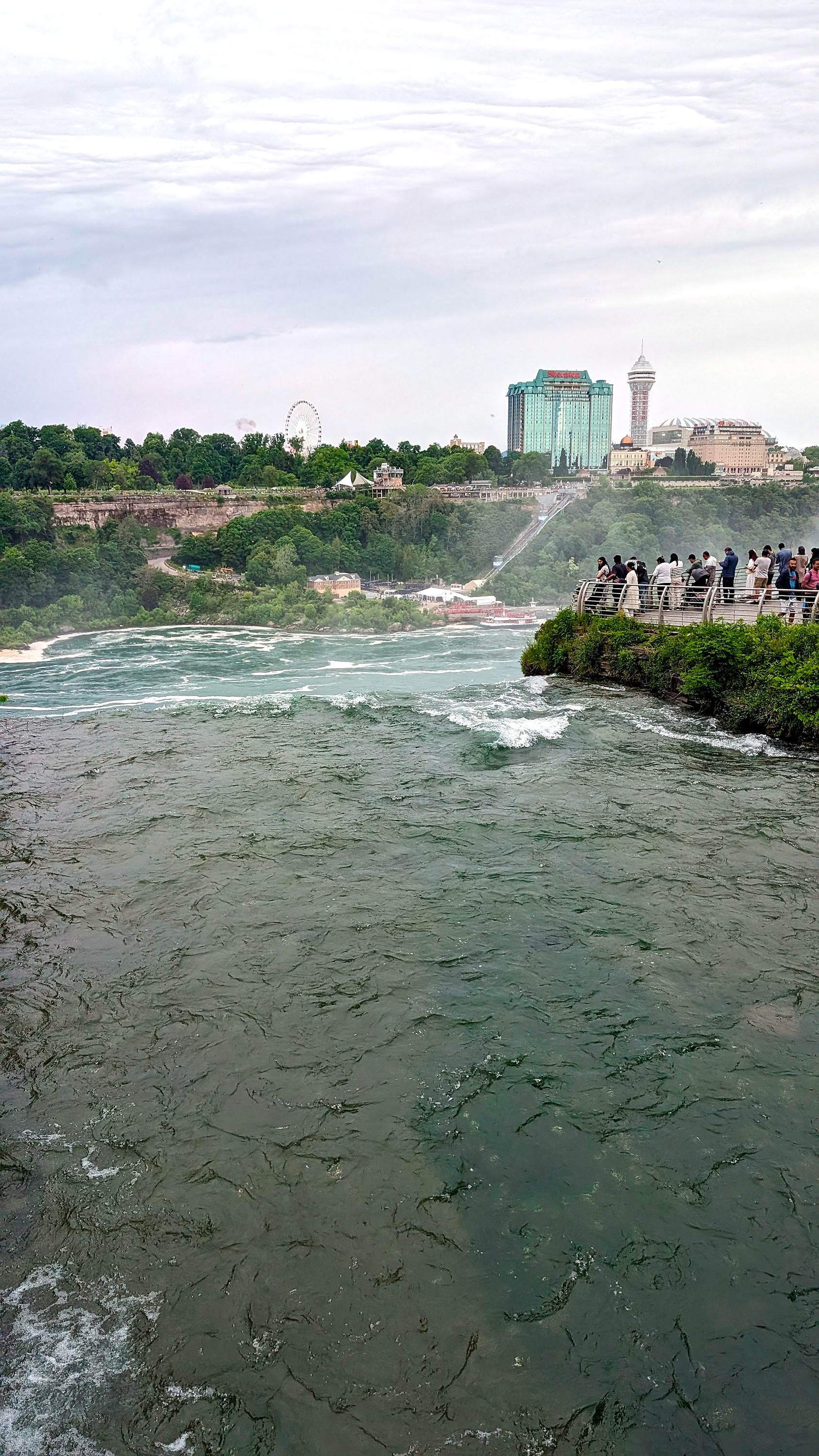 A crowd gathers to look at Bridal Veil Falls