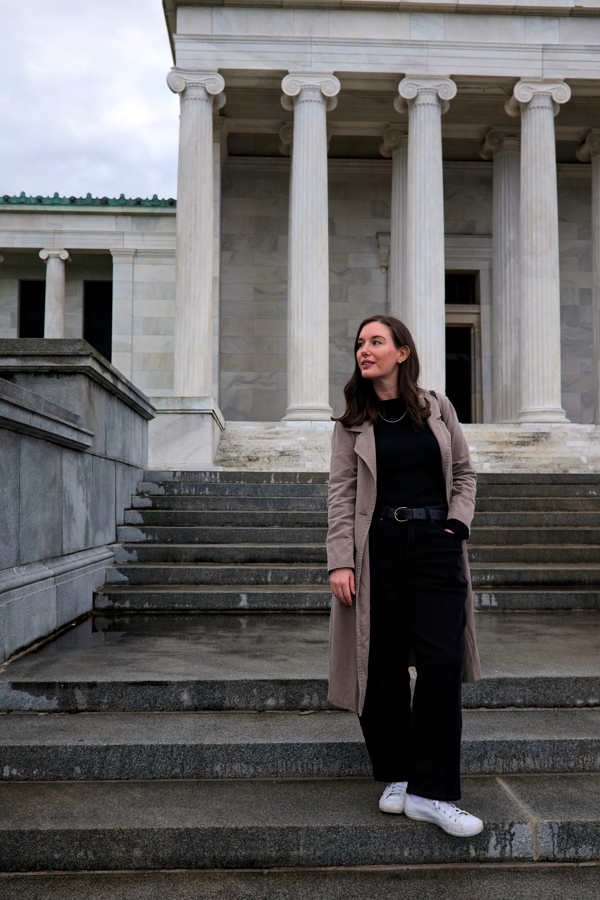 Alyssa stands on the steps of the Buffalo AKG Museum