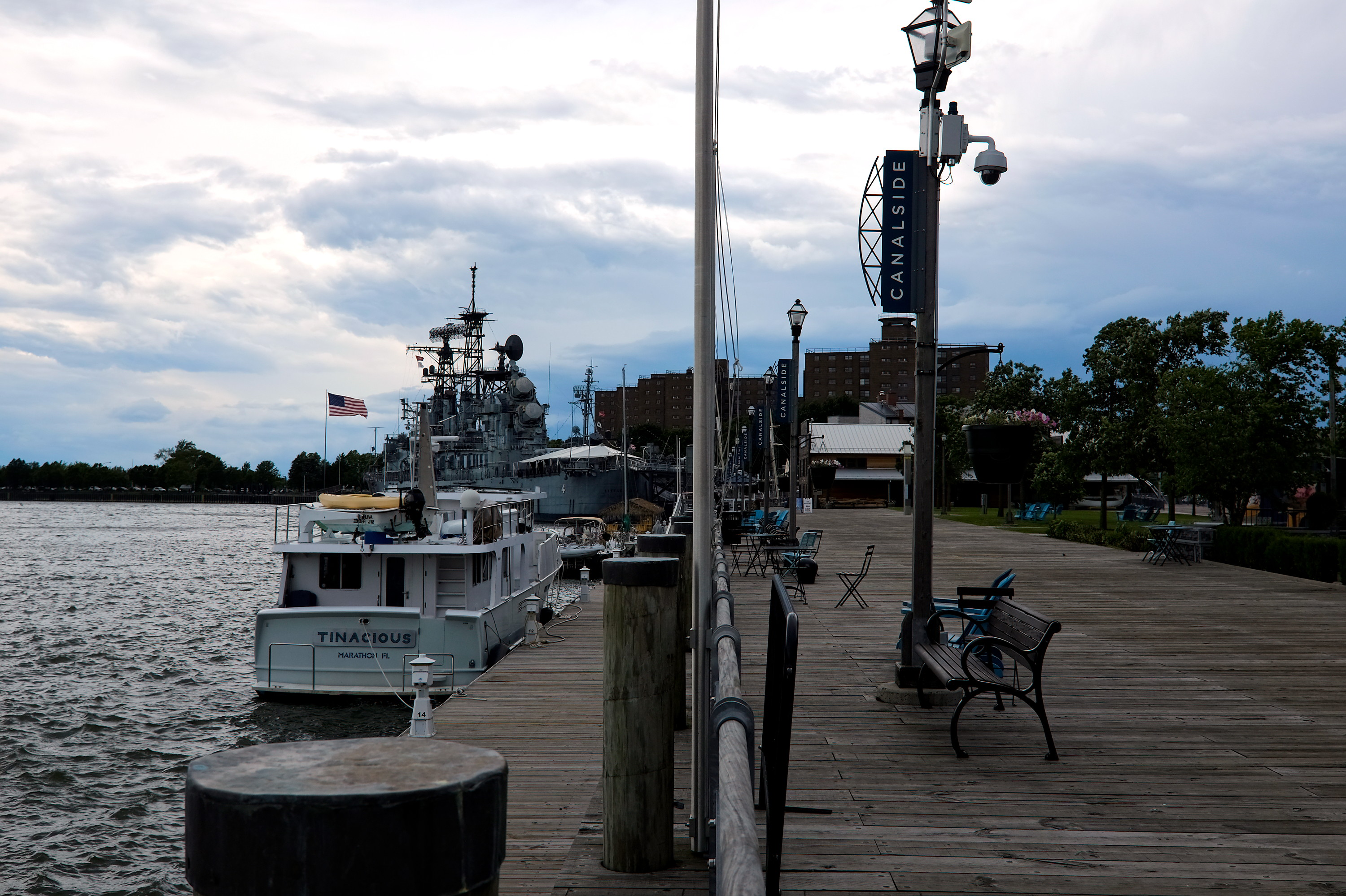 A boat tethered to a dock at Canalside