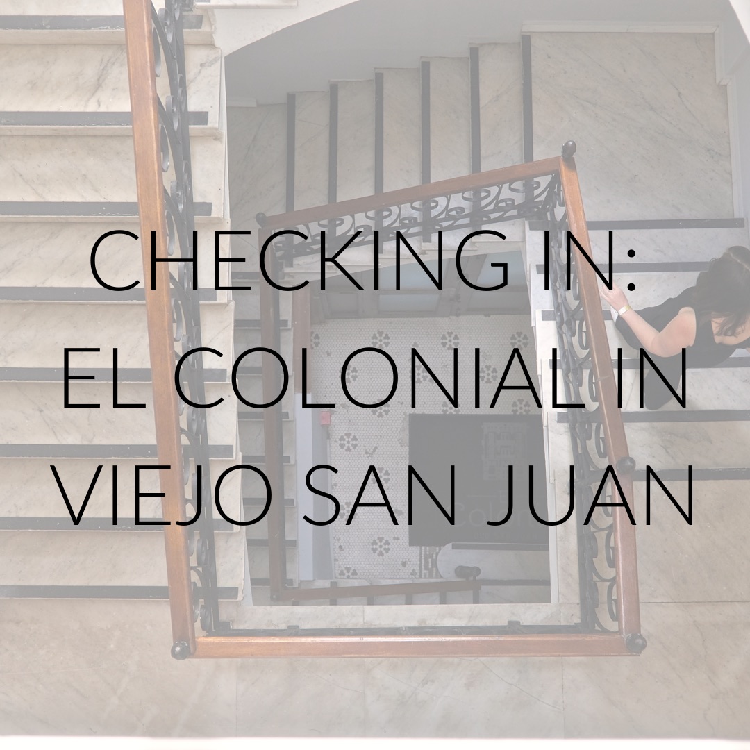 Alyssa walks down a set of stairs and text overlay reads "Checking In: El Colonial in Viejo San Juan"