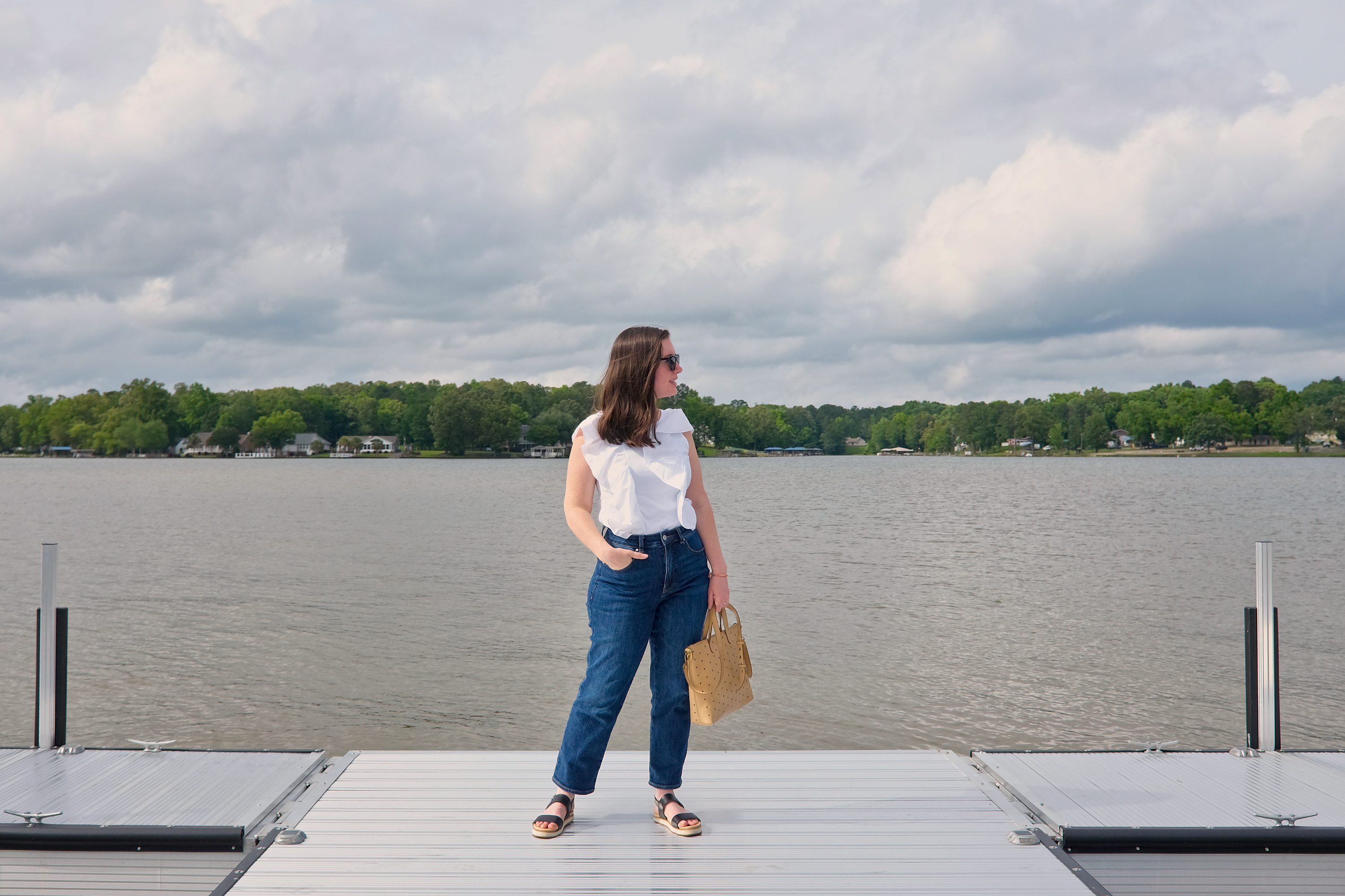 Alyssa stands on a dock at Lake Greenwood