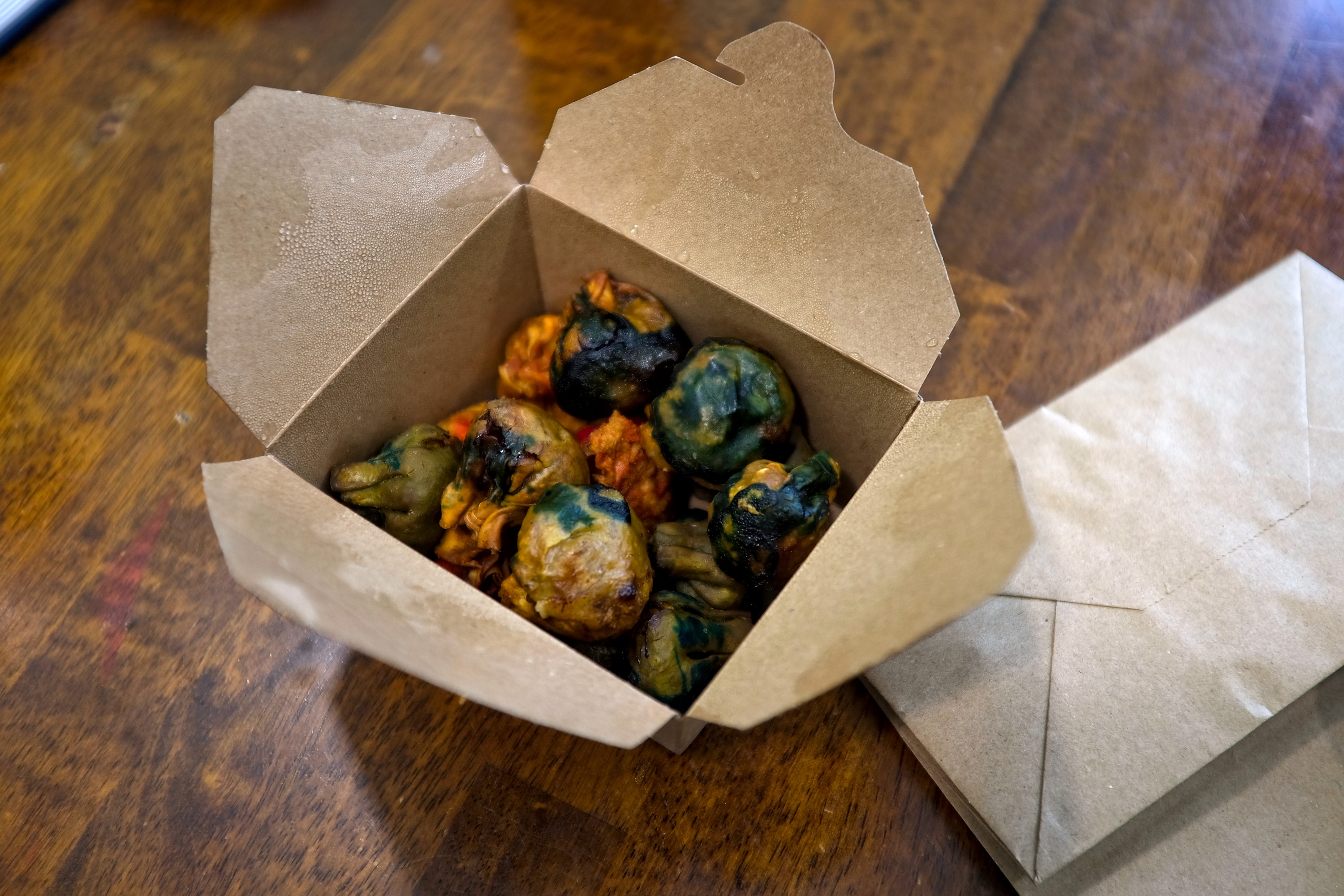 A takeout box of dumplings