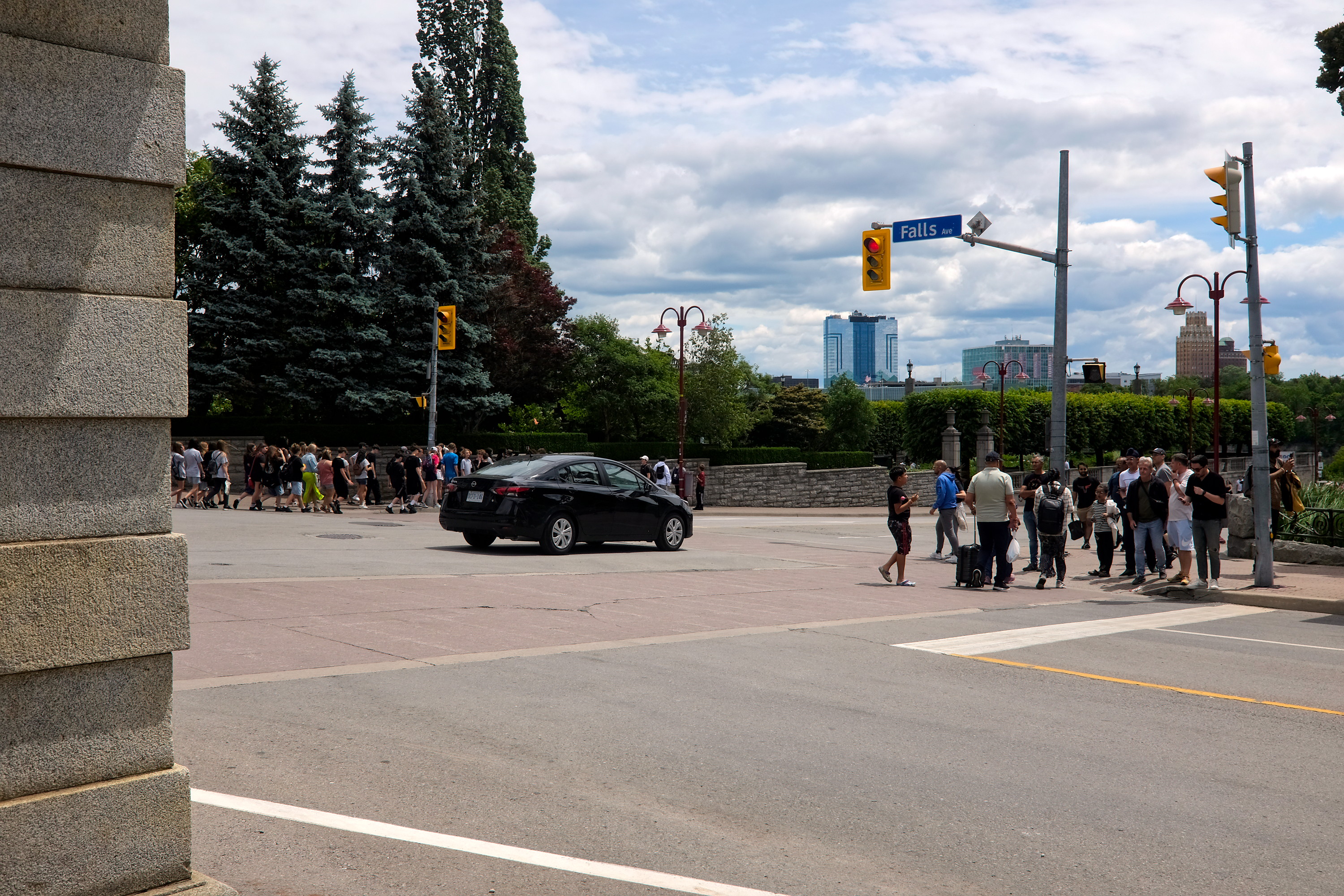 A crowd walks around Niagara Falls