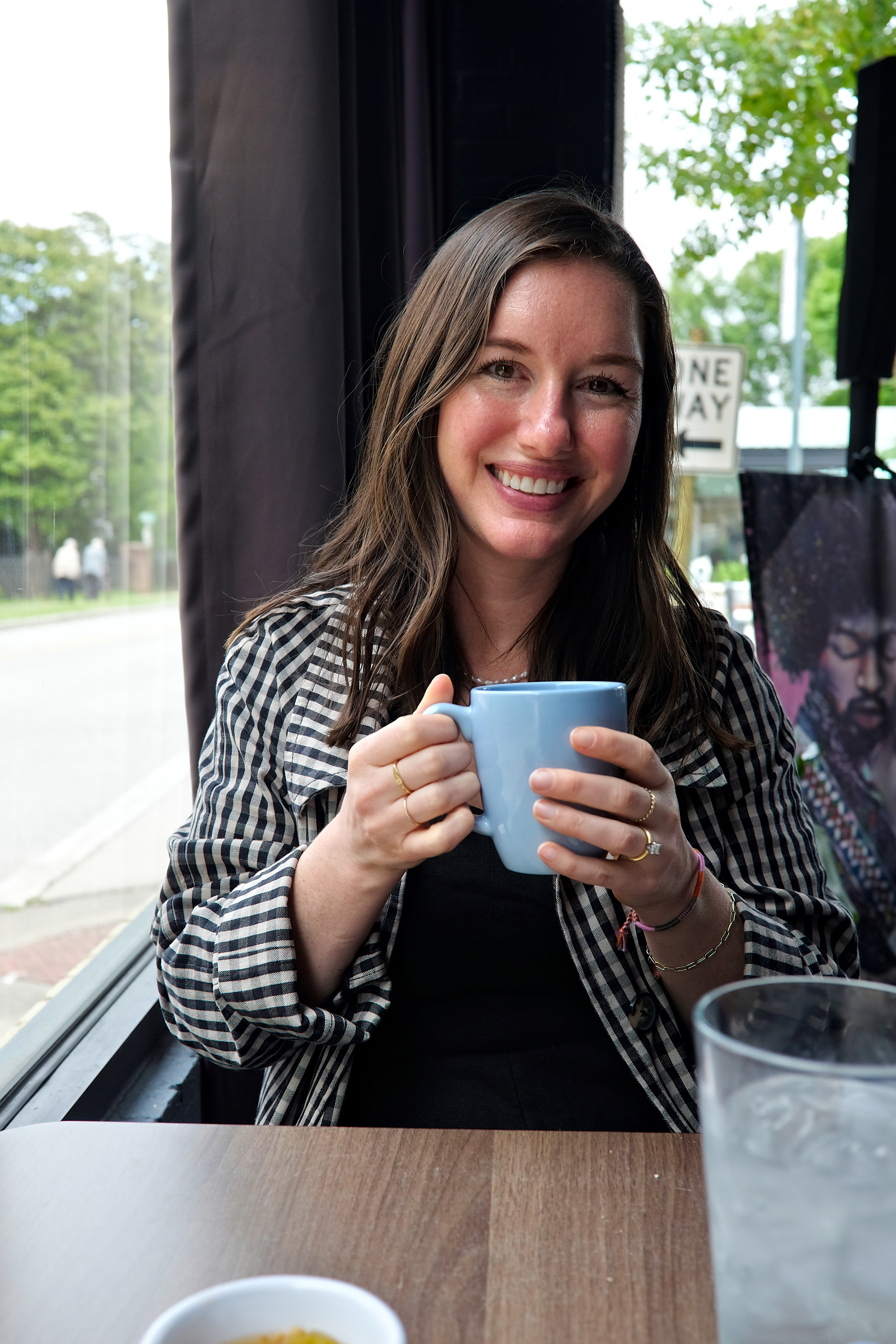 Alyssa drinks a cup of coffee in Abbeville