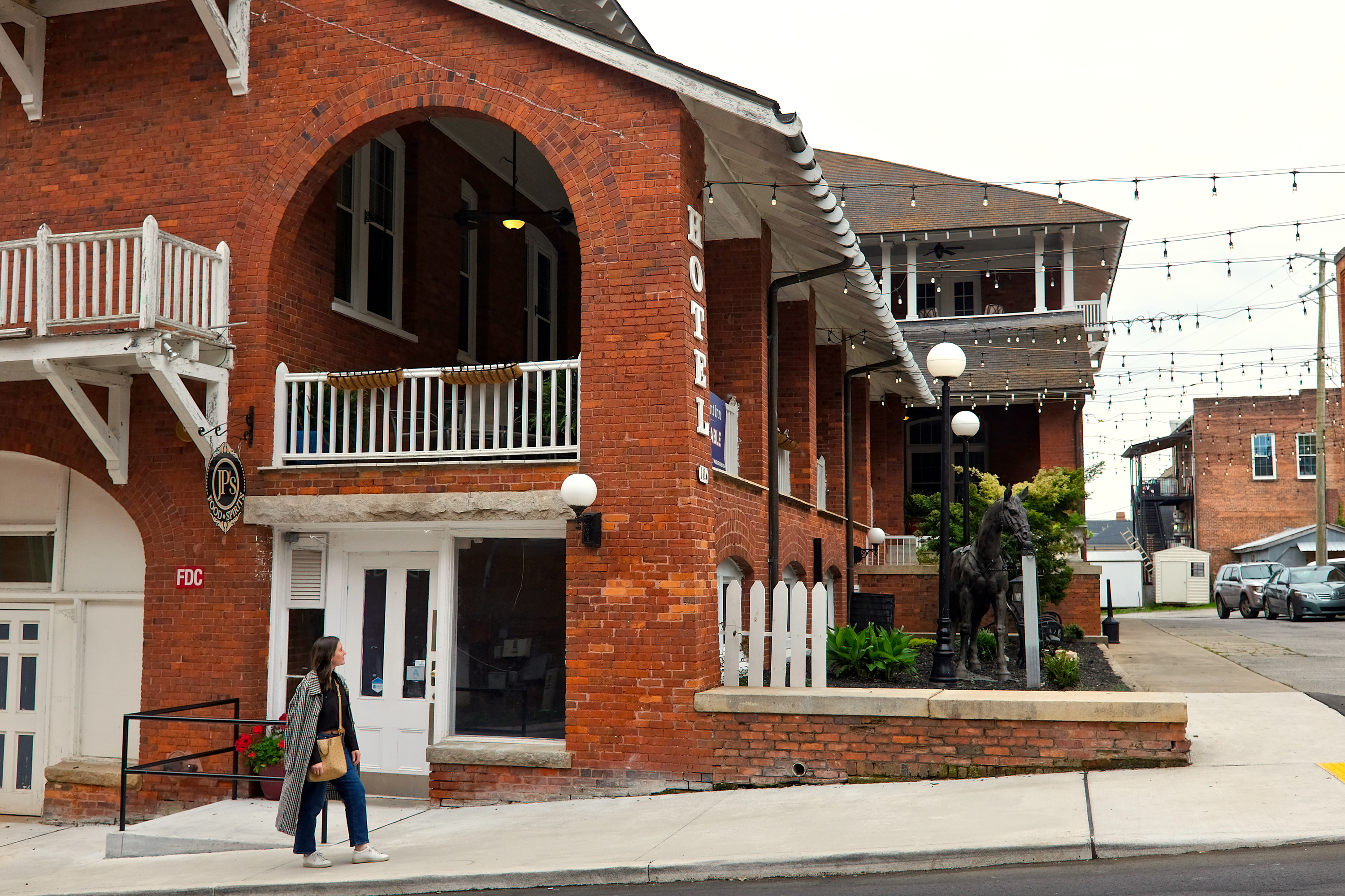 Alyssa walks by The Belmont Inn in Abbeville