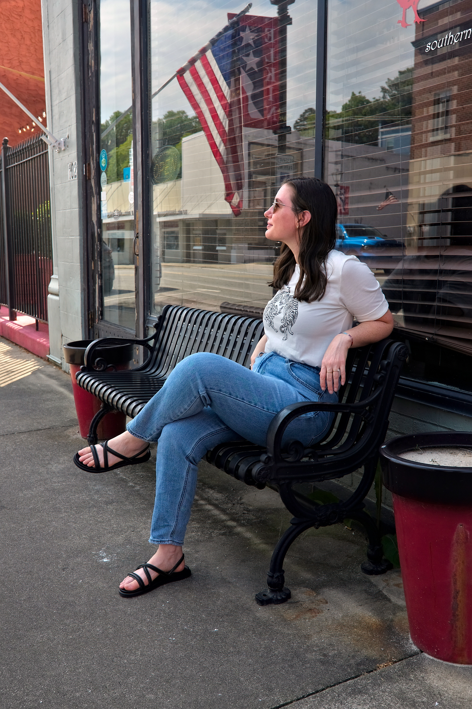 Alyssa sits on a bench in Elkin