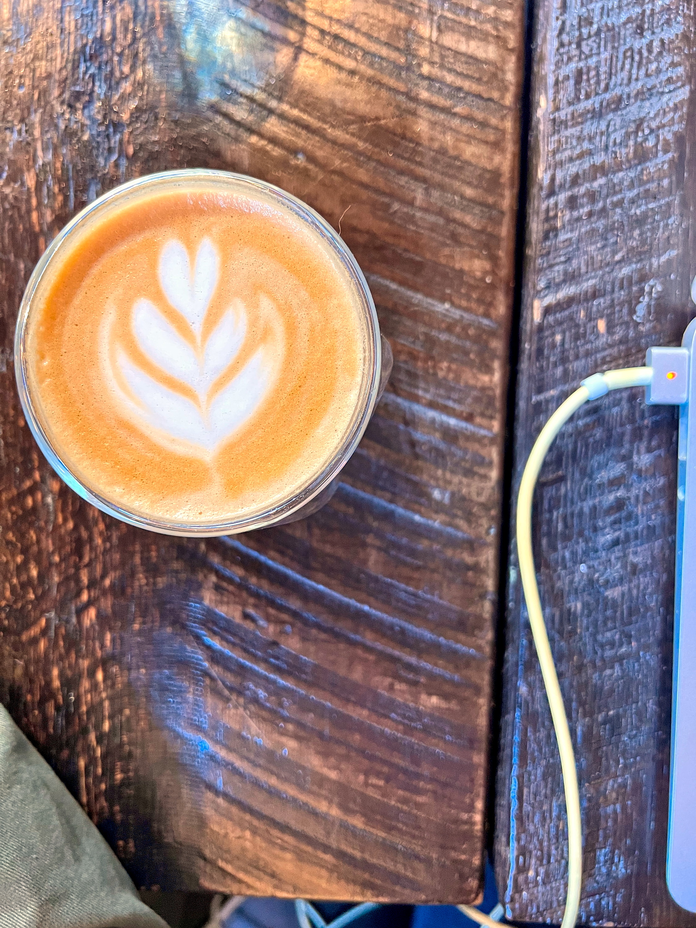 A cortado and a laptop at Killer Coffee 