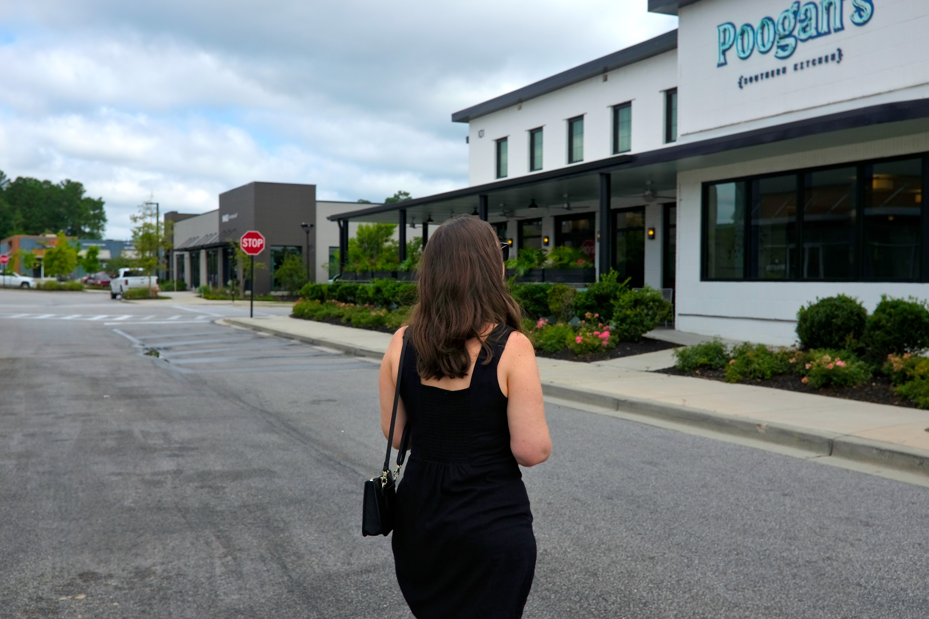 Alyssa walks toward Poogan's Southern Kitchen