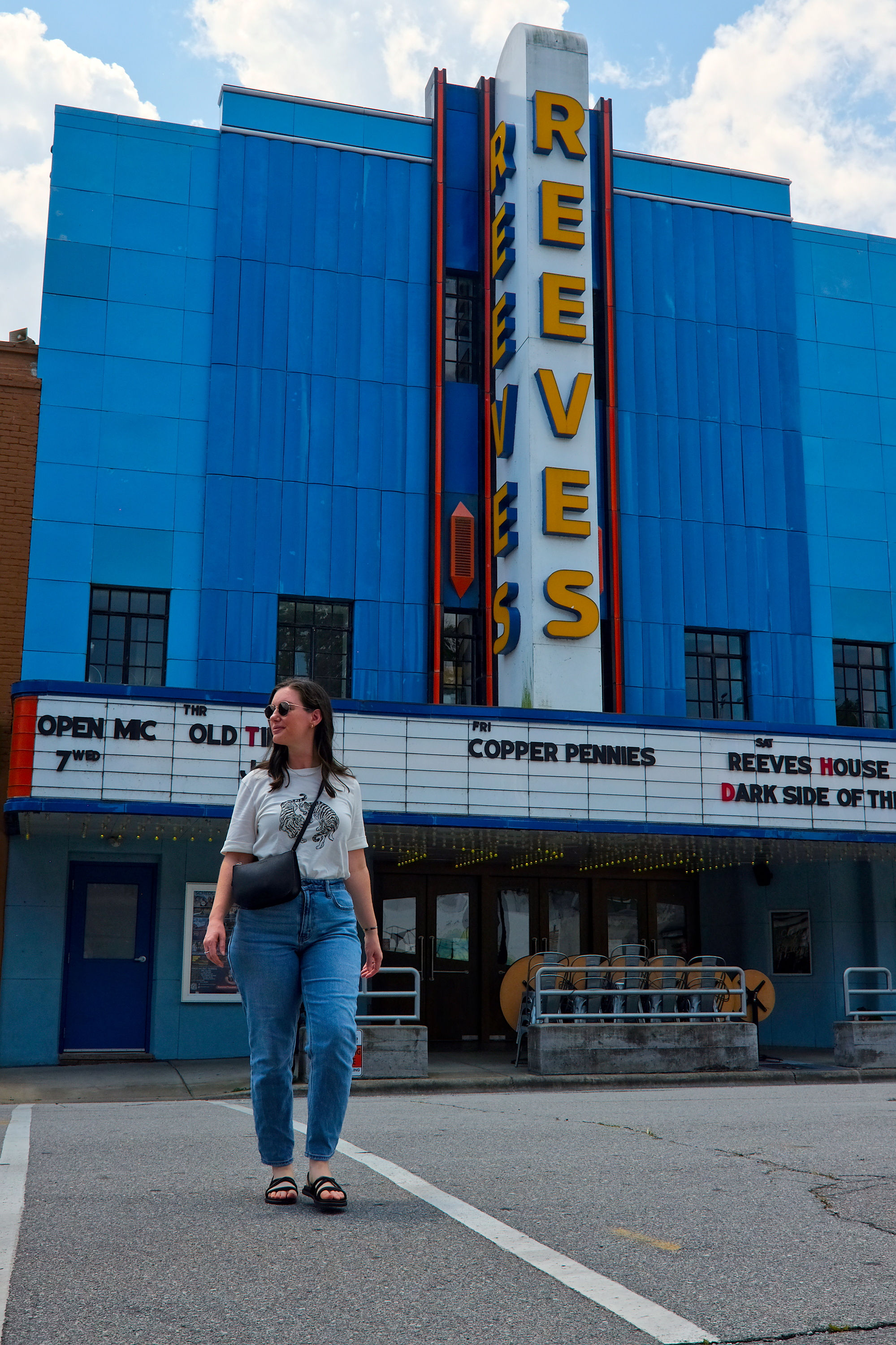 Alyssa walks in front of the Reeves Theater in Elkin