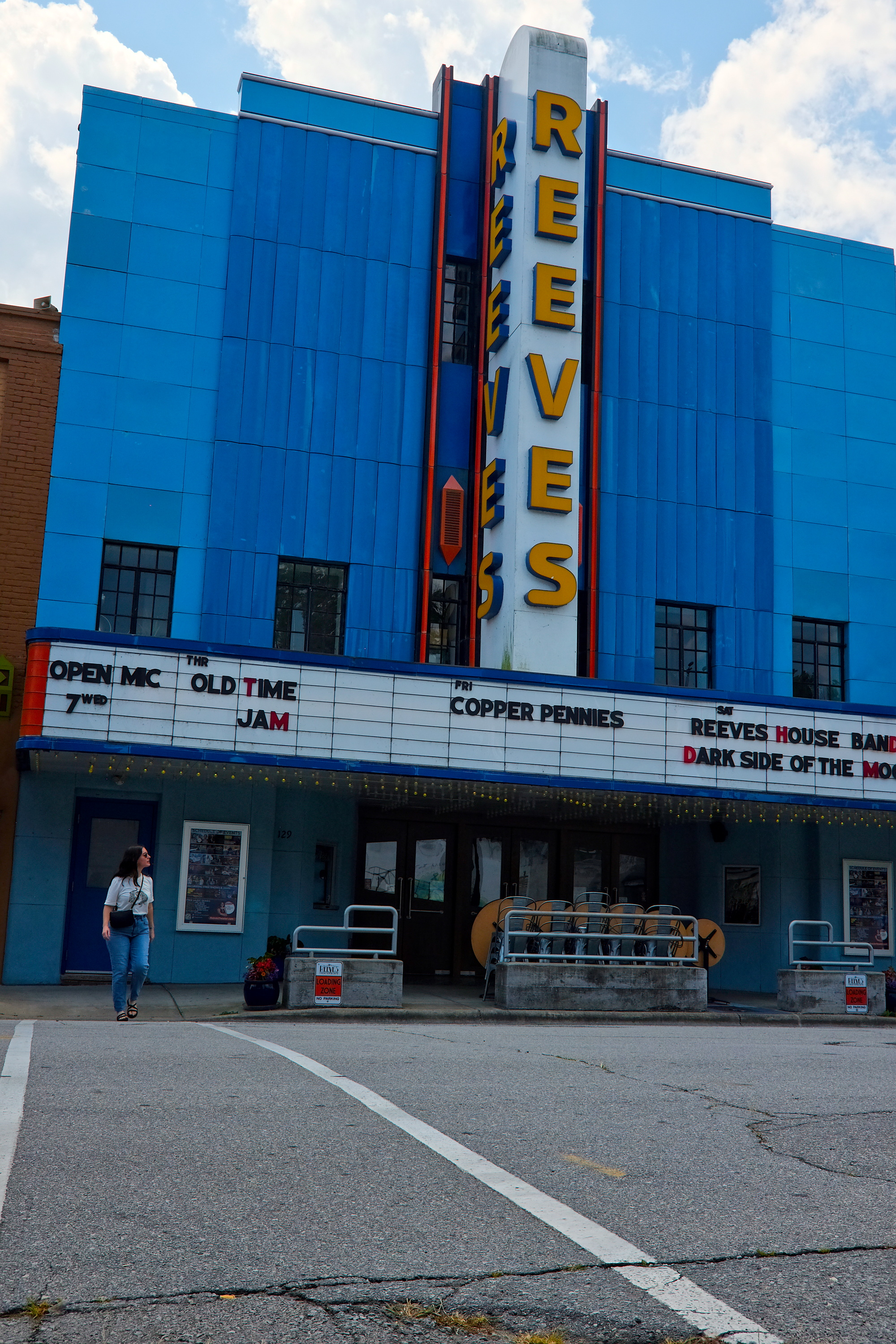 Alyssa walks in front of the Reeves Theater
