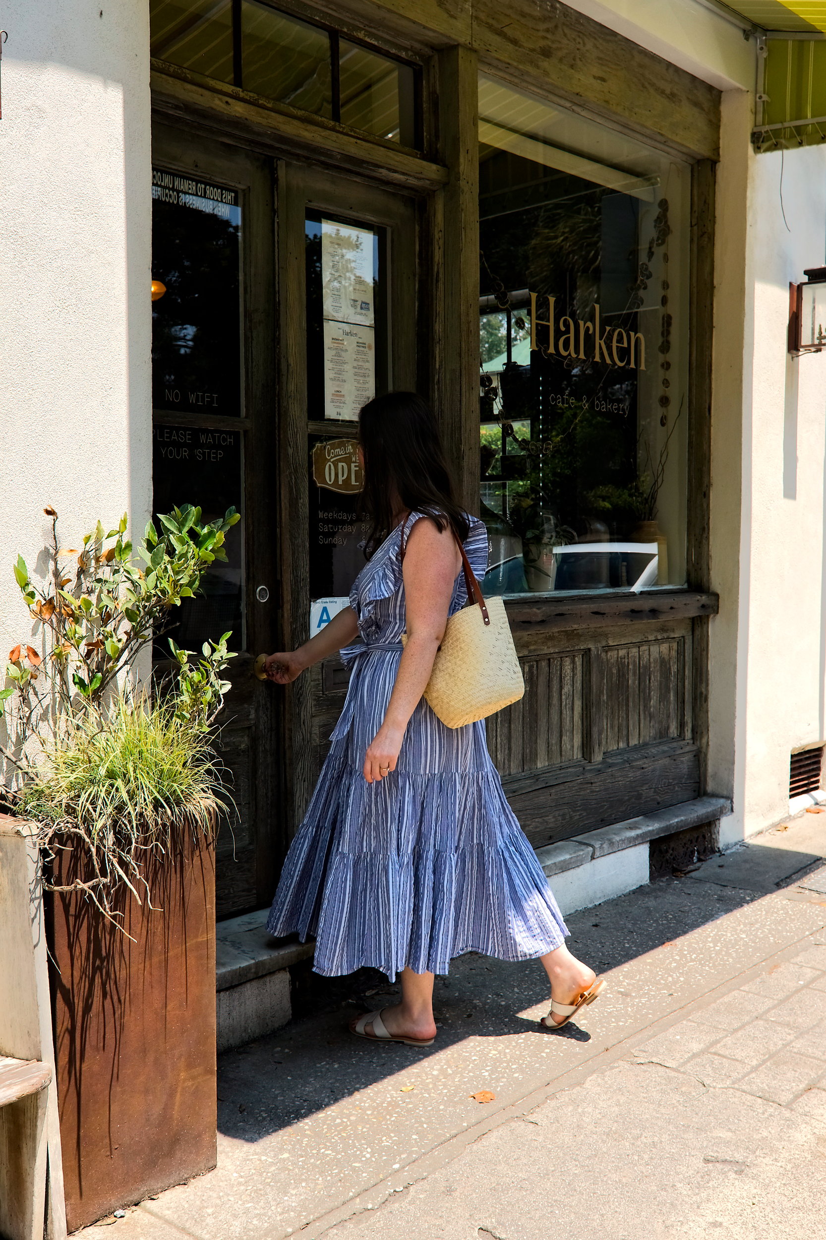 Alyssa walks into Harken Cafe in Charleston, SC