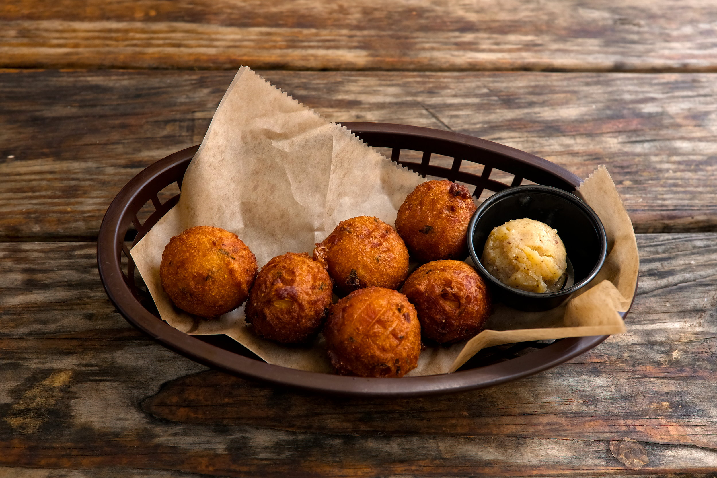 A basket of hush puppies at a restaurant in Charleston