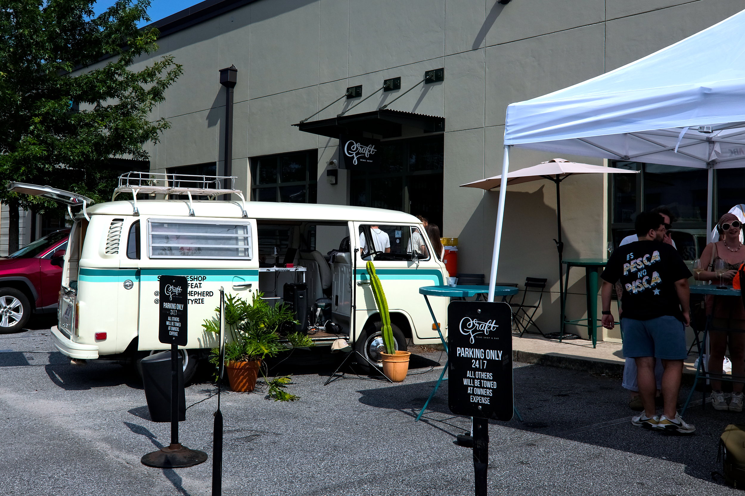 People gather outside Graft Wine Bar in Charleston