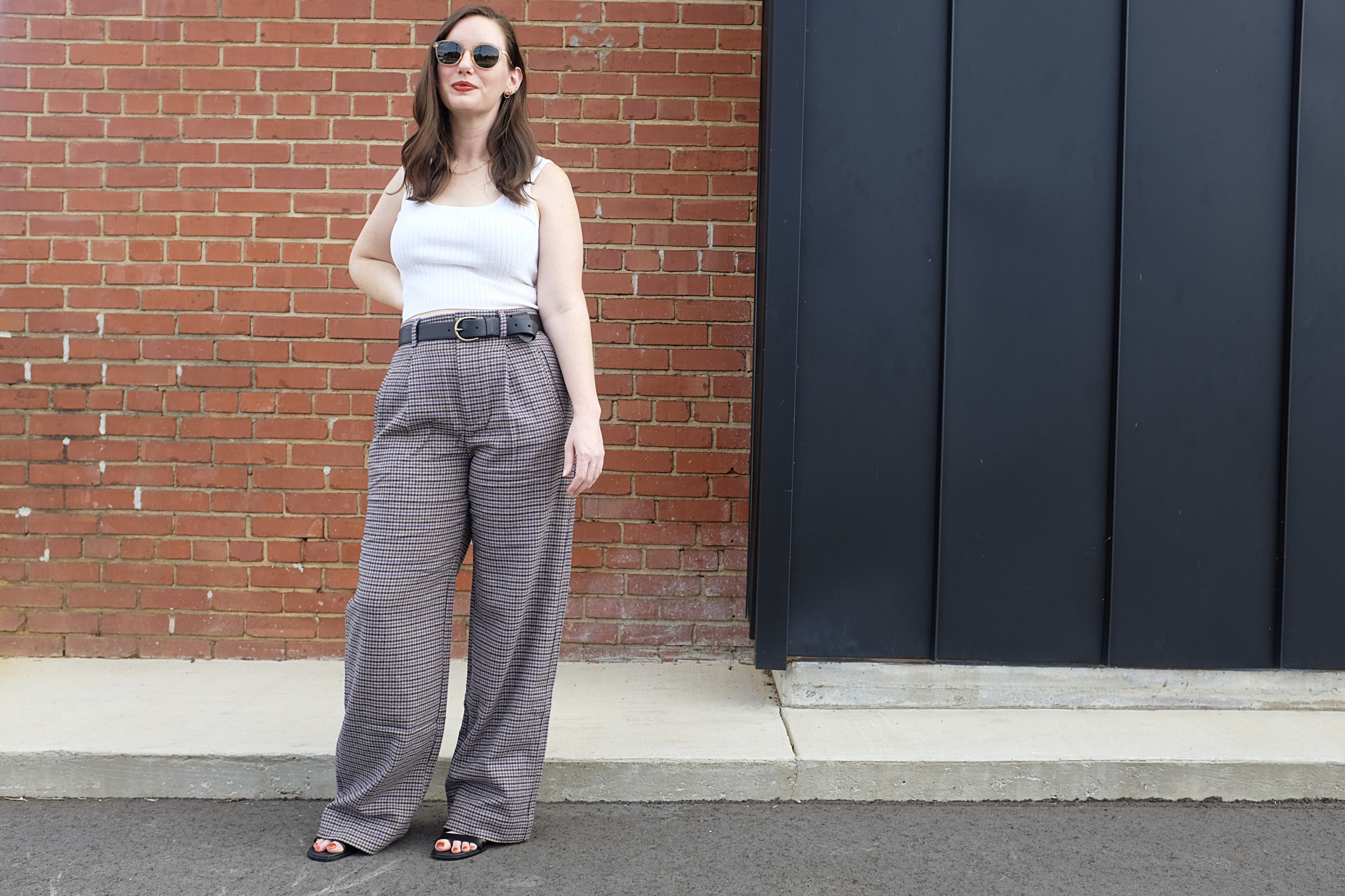 Alyssa wears wool houndstooth pants with a crop top with items in Labor Day sales