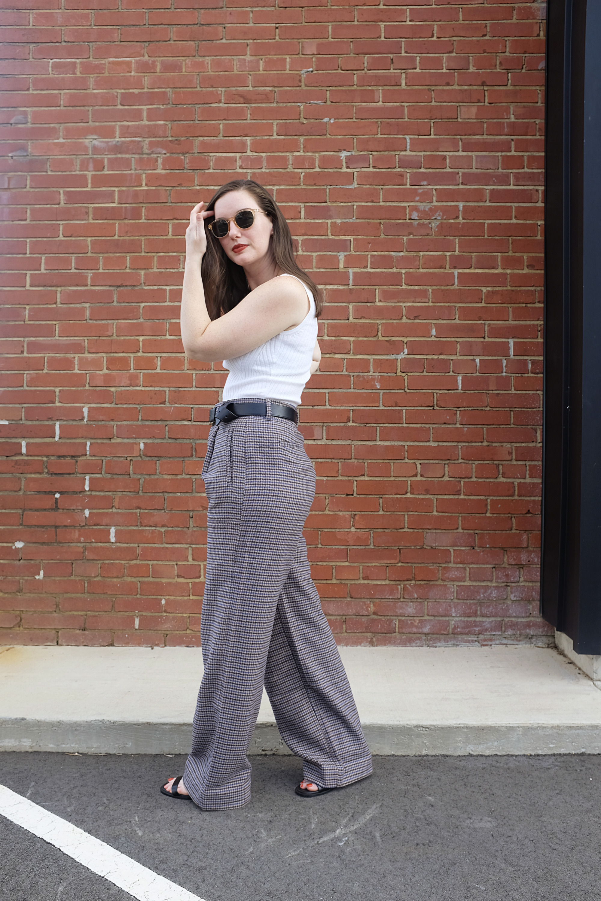 Alyssa wears wool houndstooth pants with a crop top