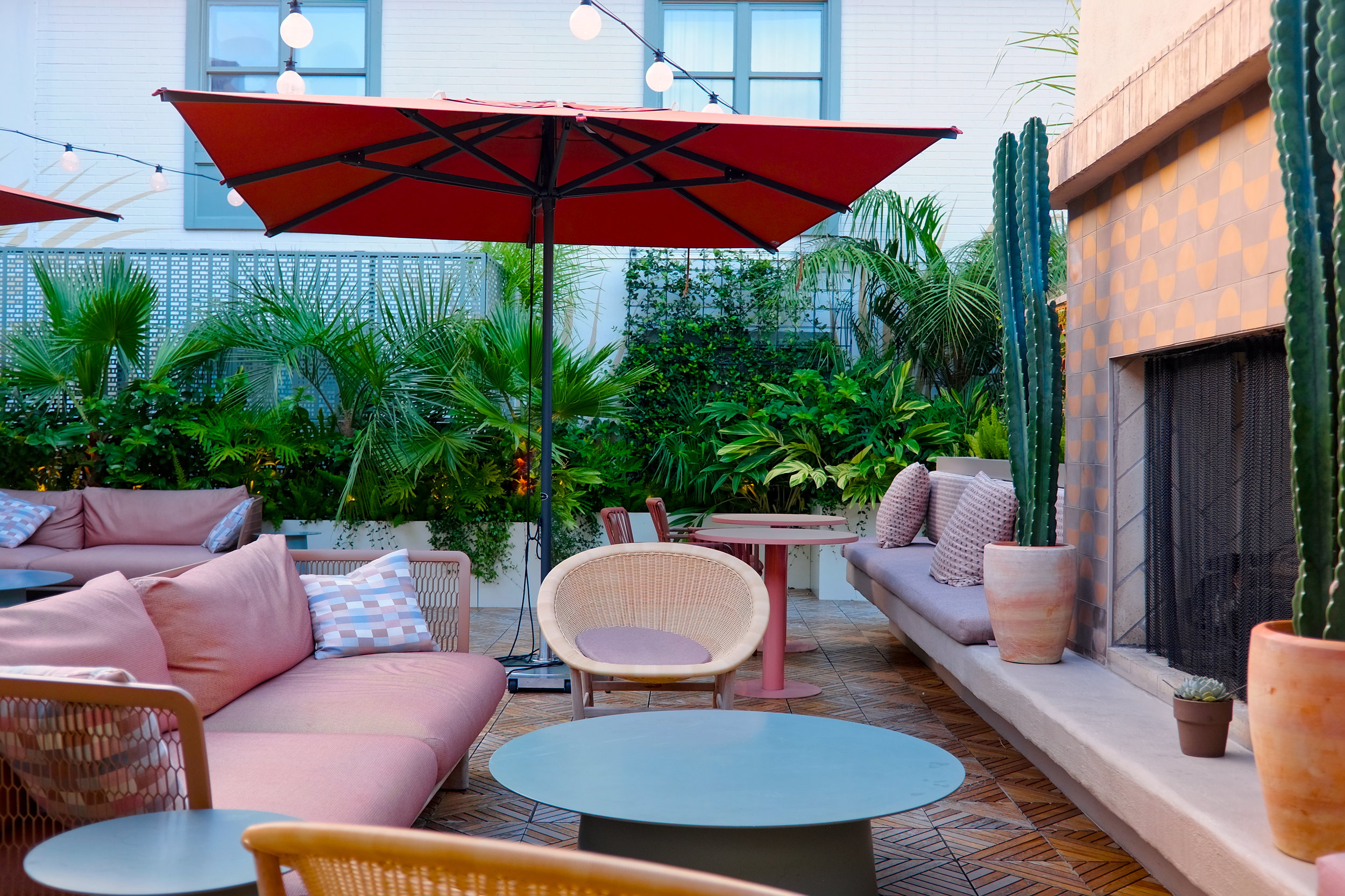 A patio at one of the many Charleston bars featured in this post: The Backyard at Little Palm