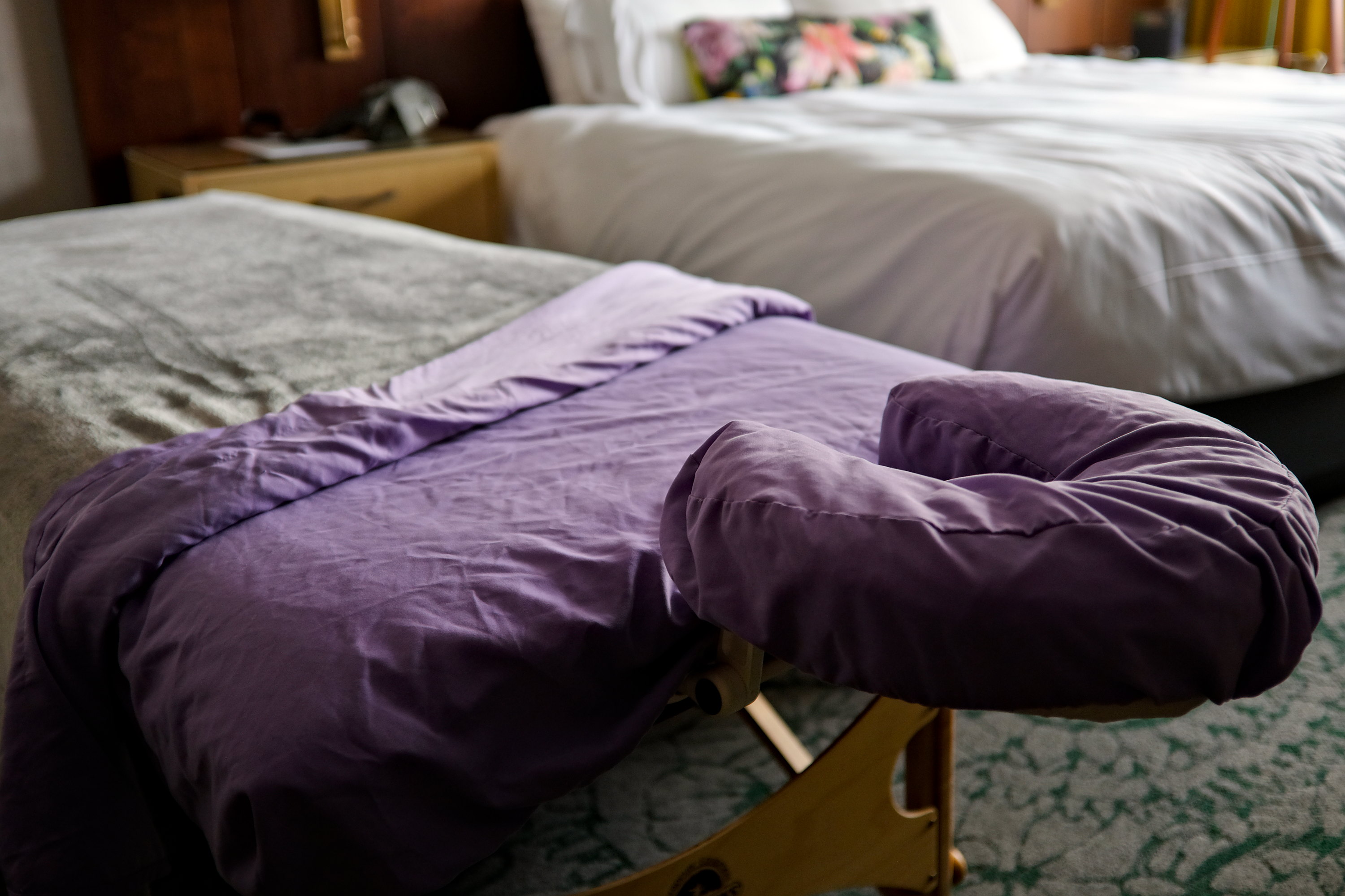 A massage table set up in a hotel room