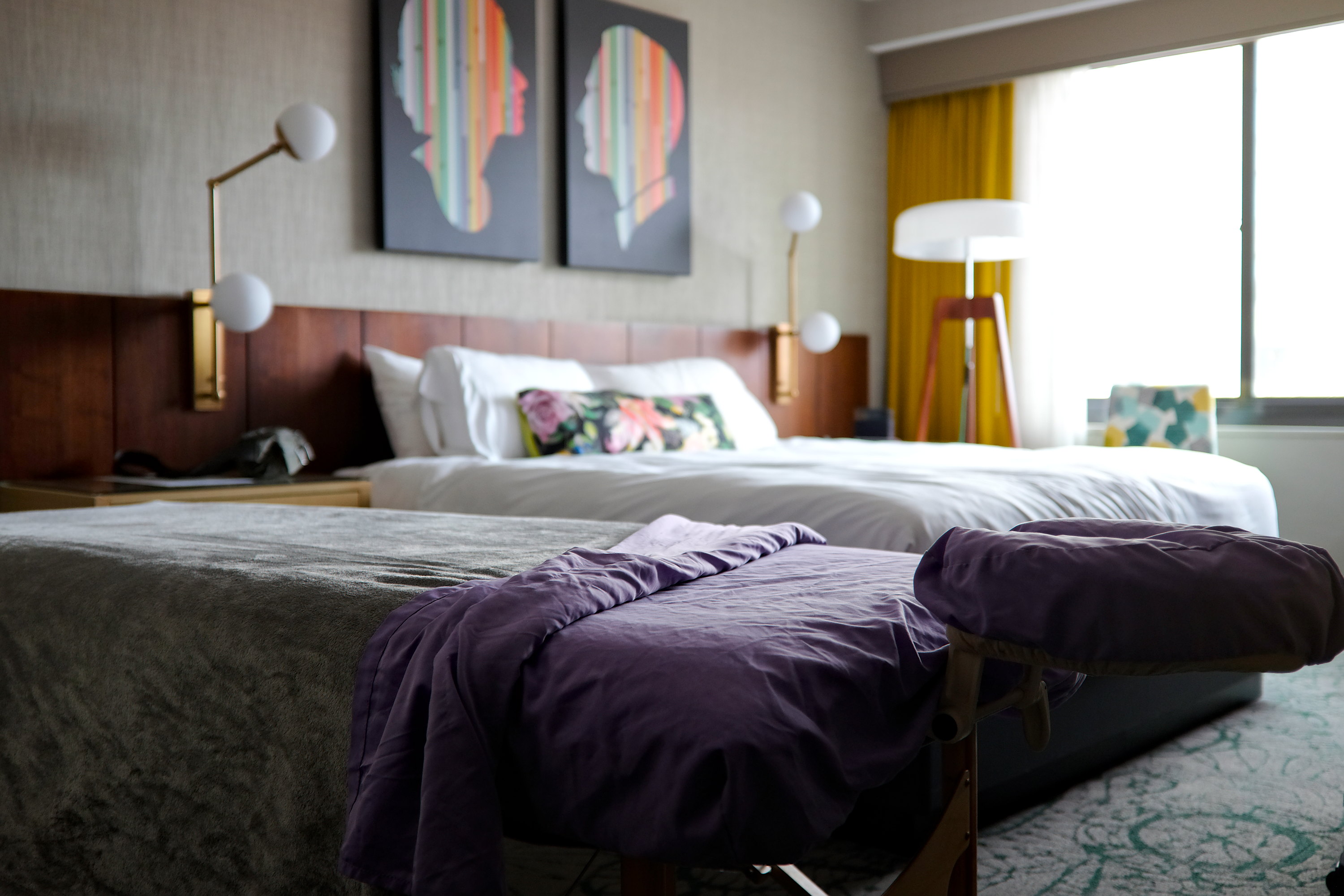 A massage table is set up in a hotel room for a Soothe appointment