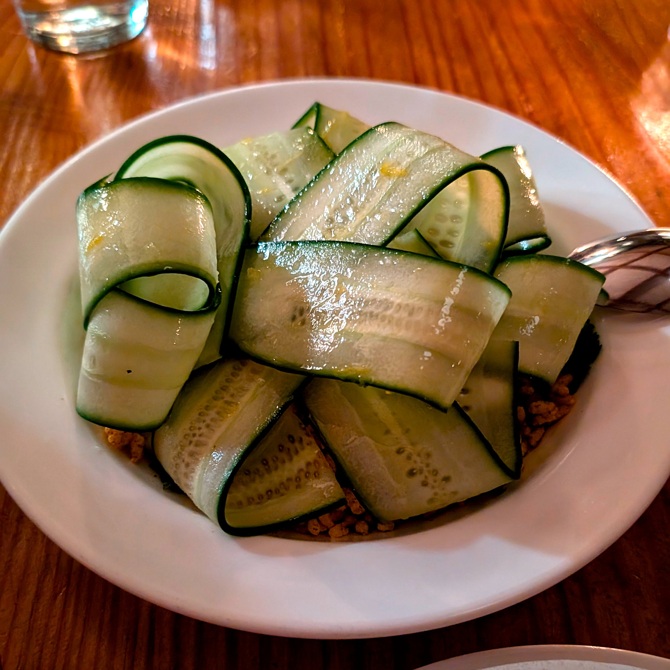 A cucumber salad on a plate at Vern's