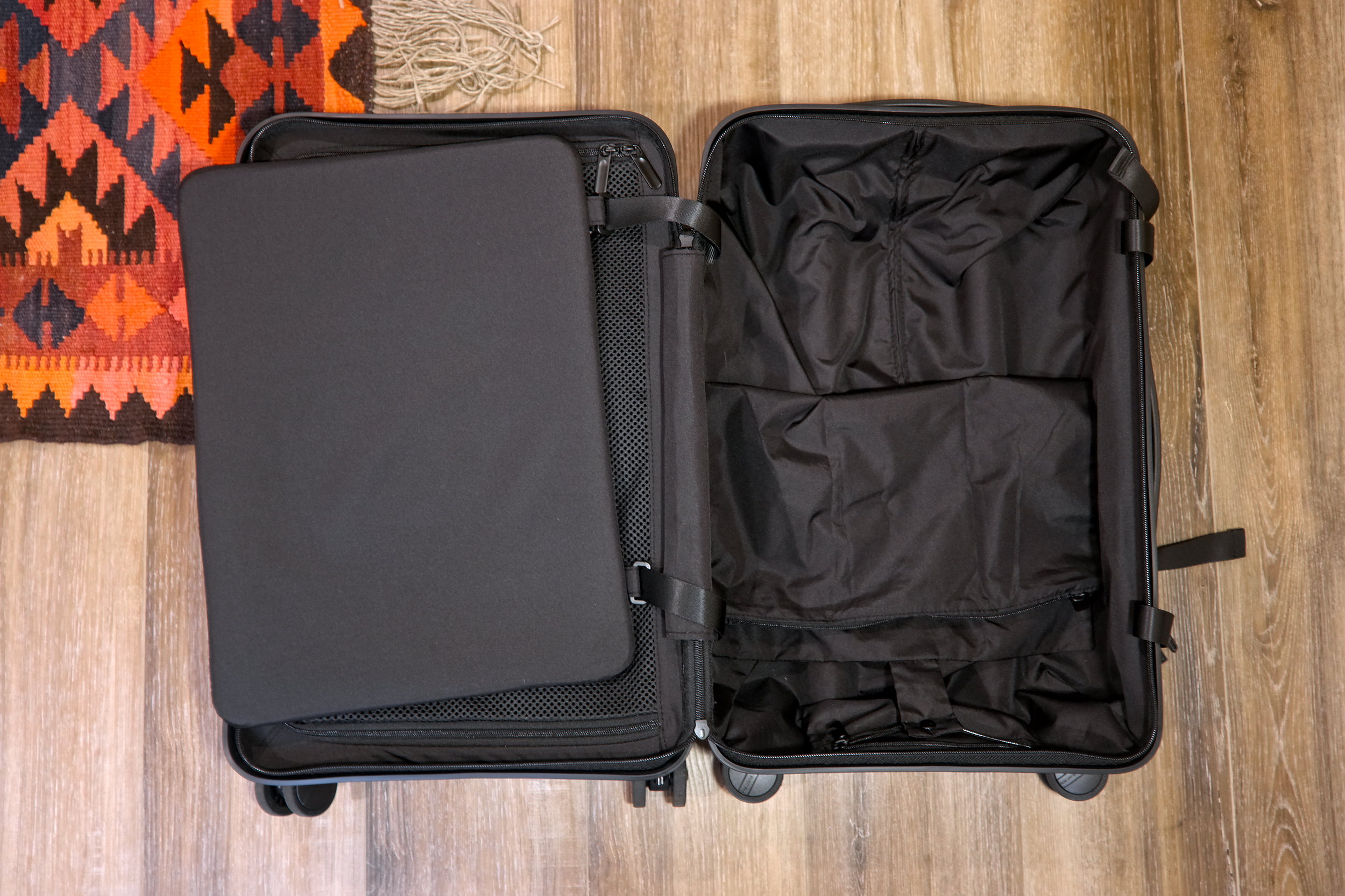 Interior of the Quince suitcase with the compression pad opened