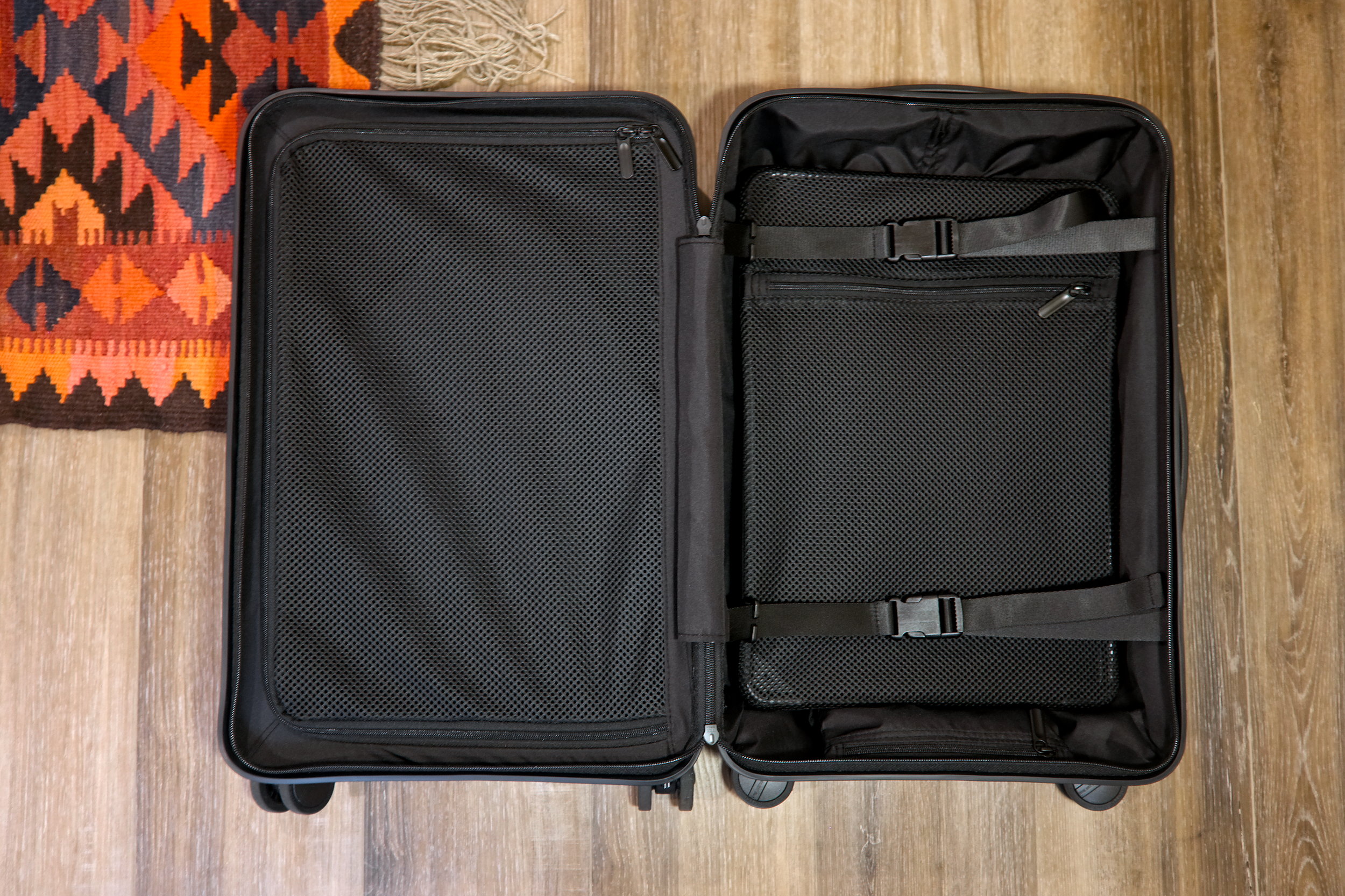 Interior of the Quince suitcase with the clasps and zippers fastened