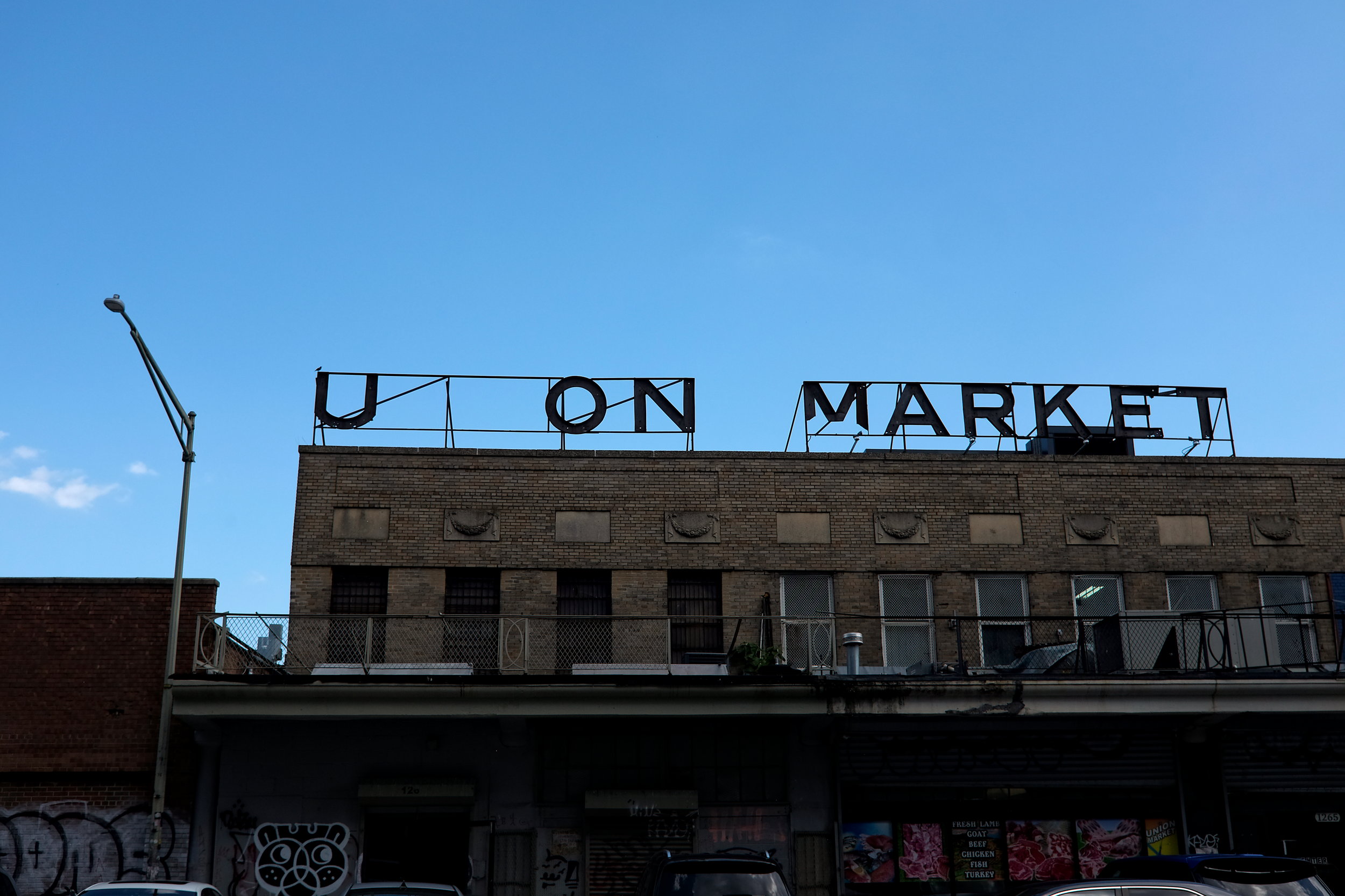 A partially broken sign at Union Market in DC