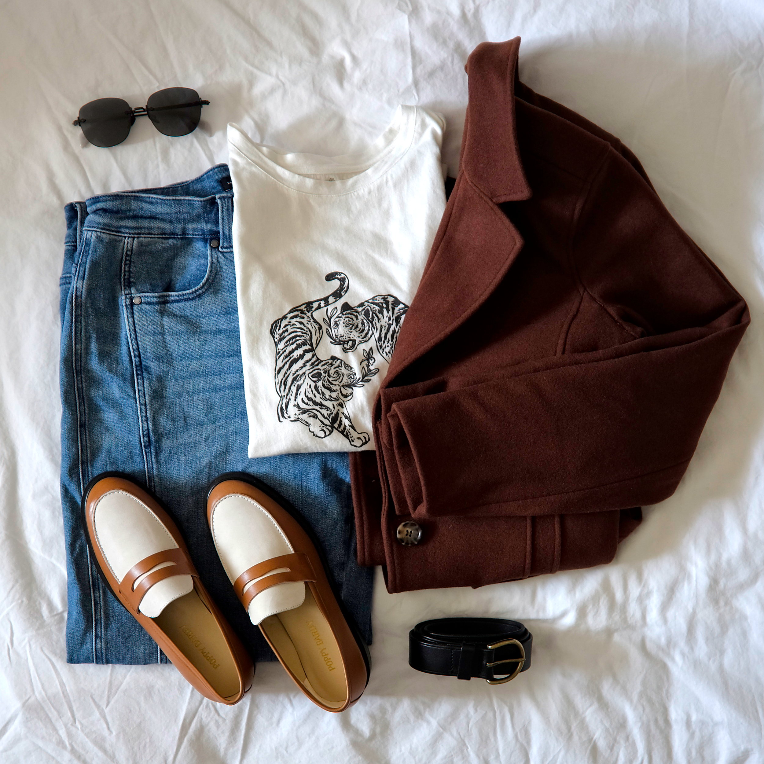 A graphic tee with a brown wool blazer and jeans and loafers