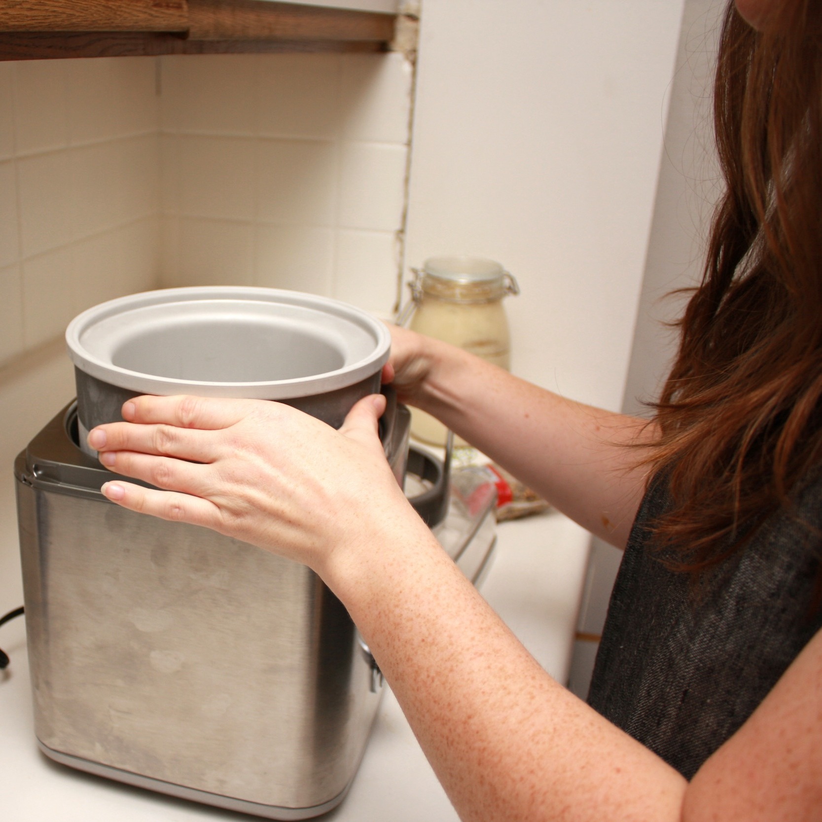 Alyssa sets the canister in the ice cream maker