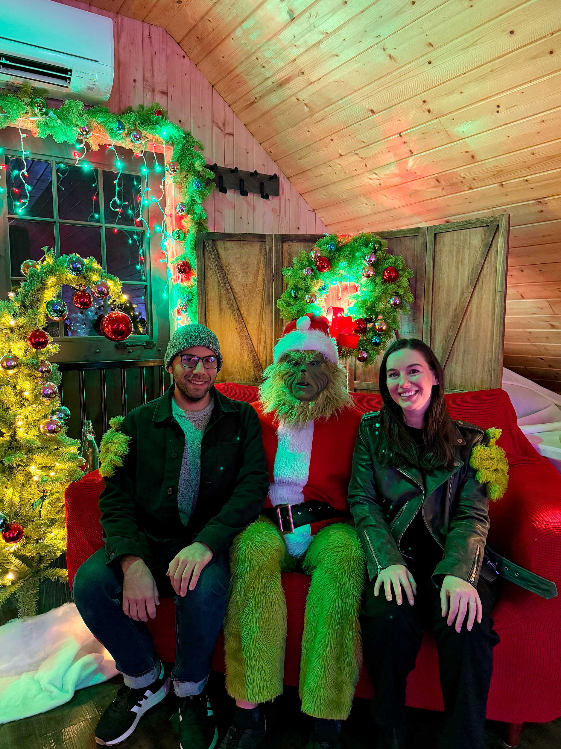 Michael and Alyssa sit with the Grinch