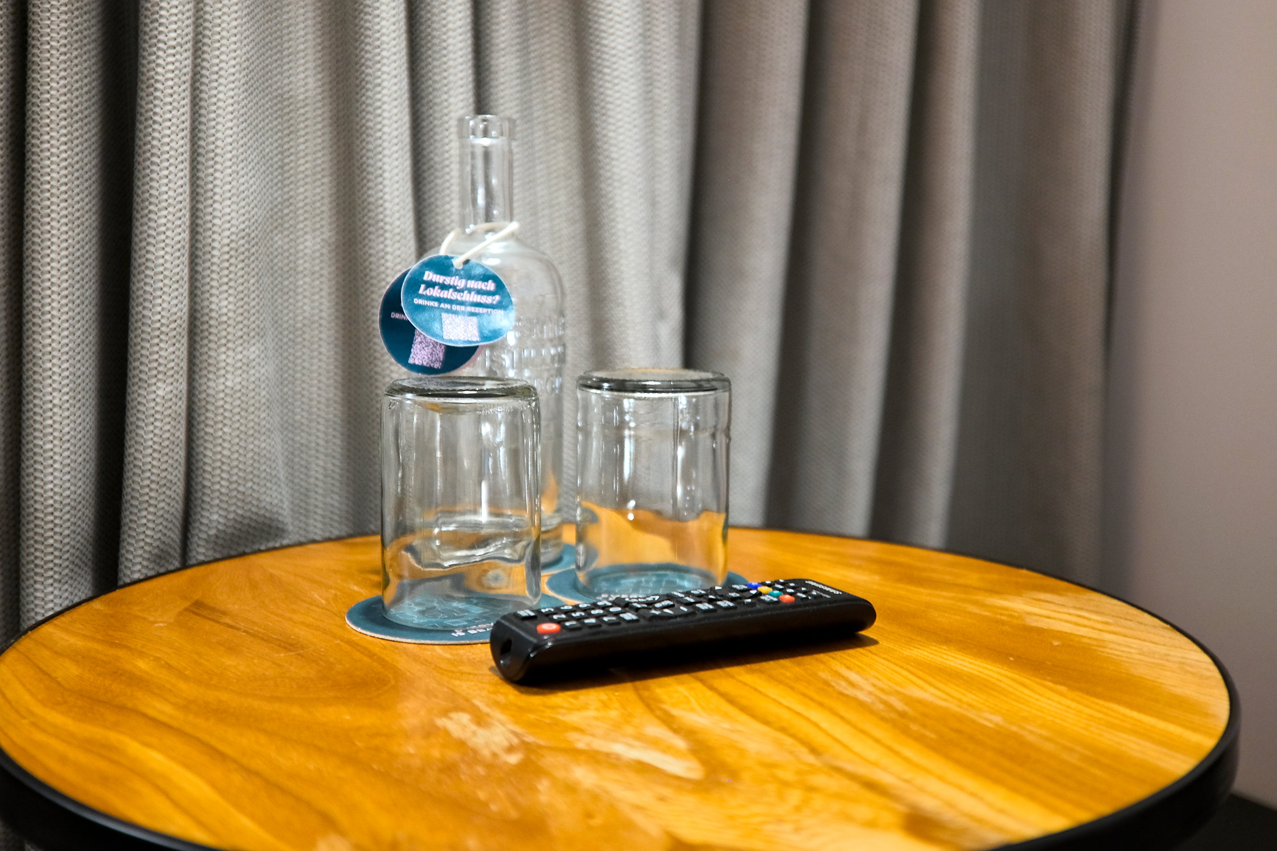 A glass carafe and two glasses