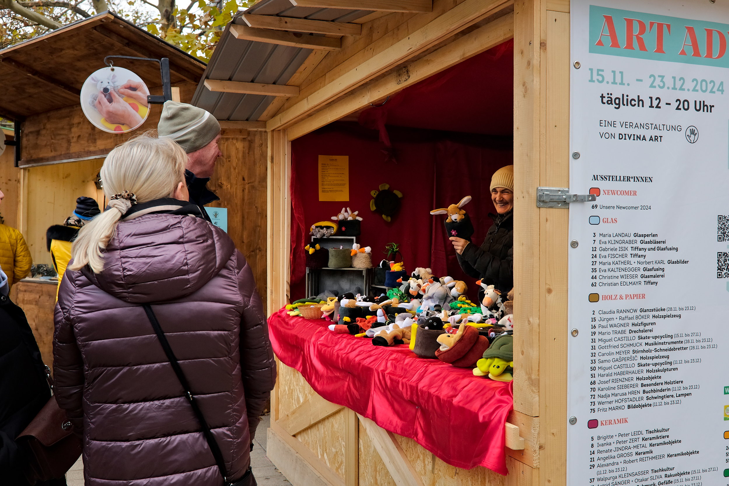 A vendor shows off her puppets