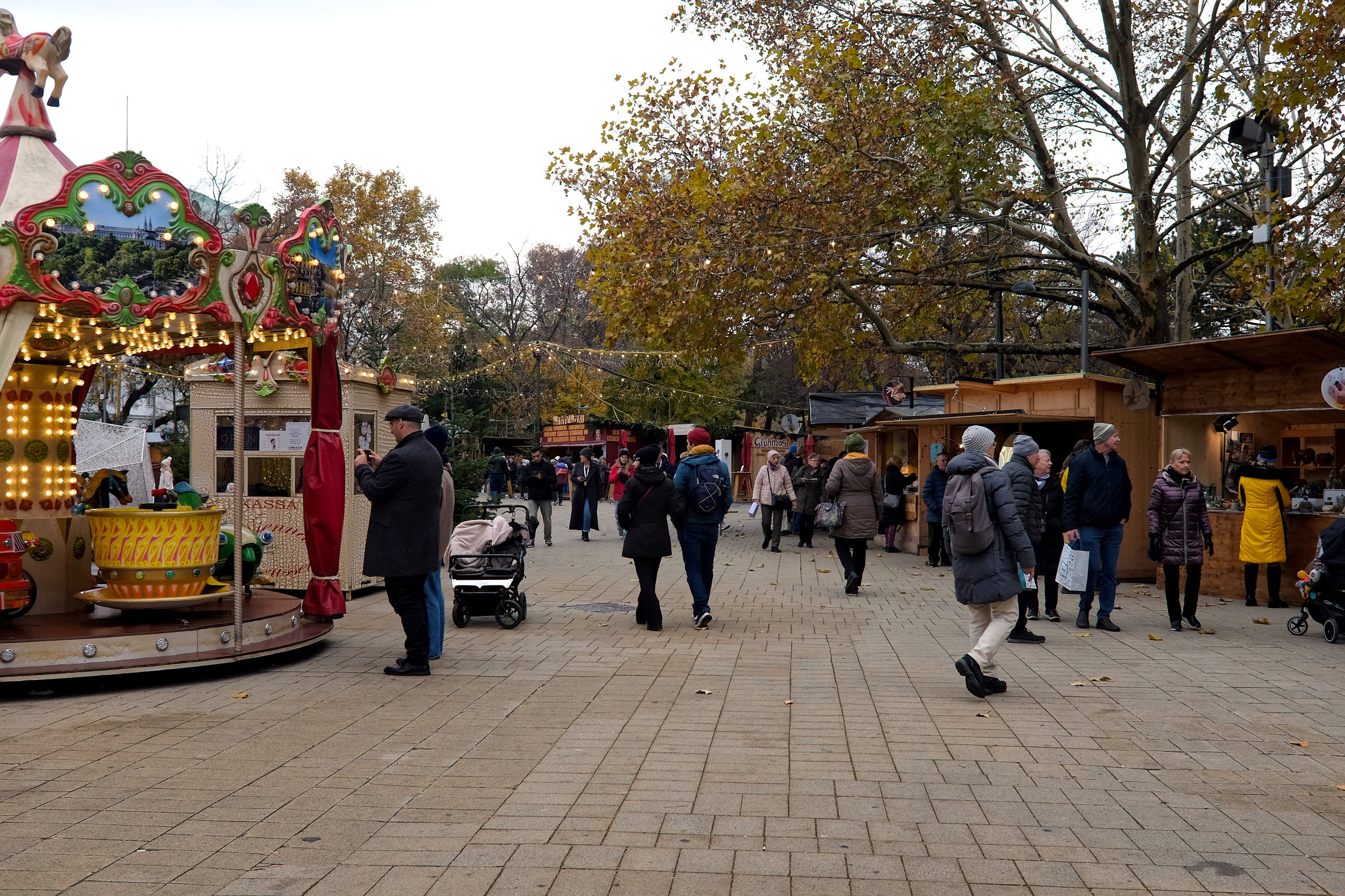 A group of people check out the Art Advent Market