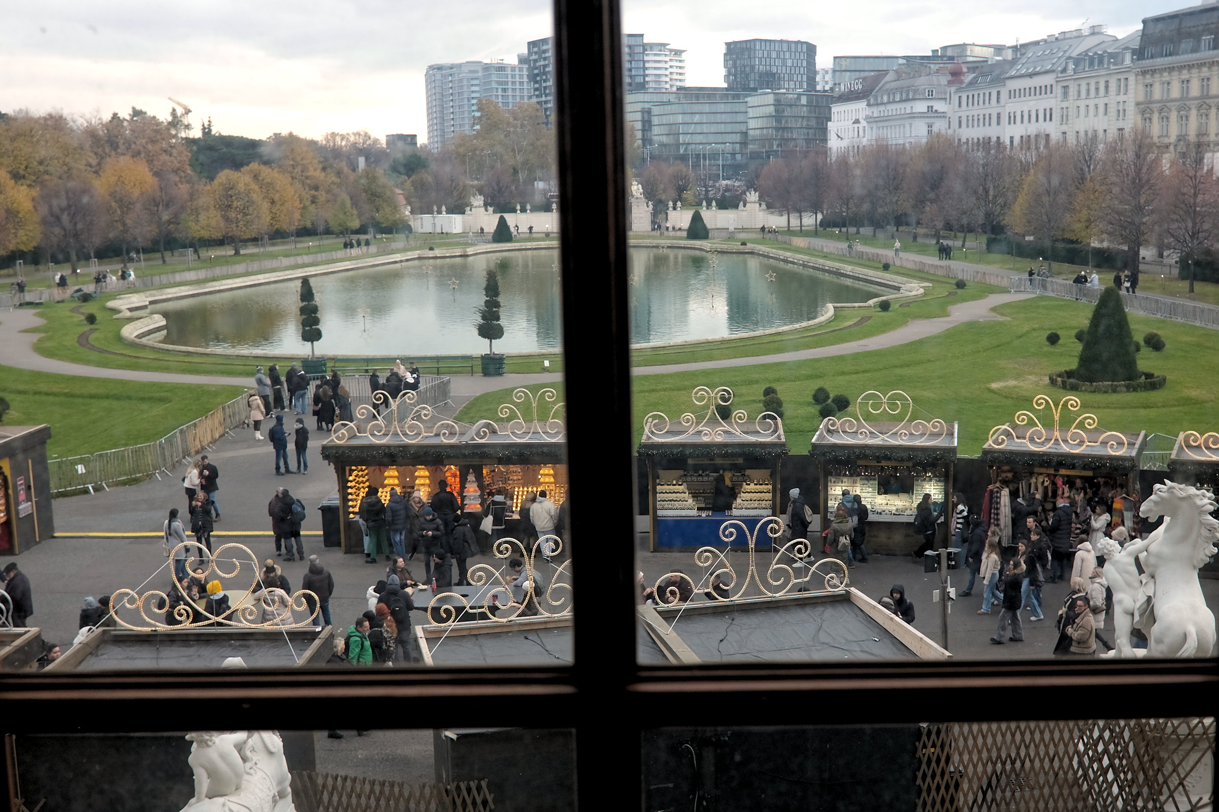 The Belvedere Palace Christmas Village is seen through a window in the palace