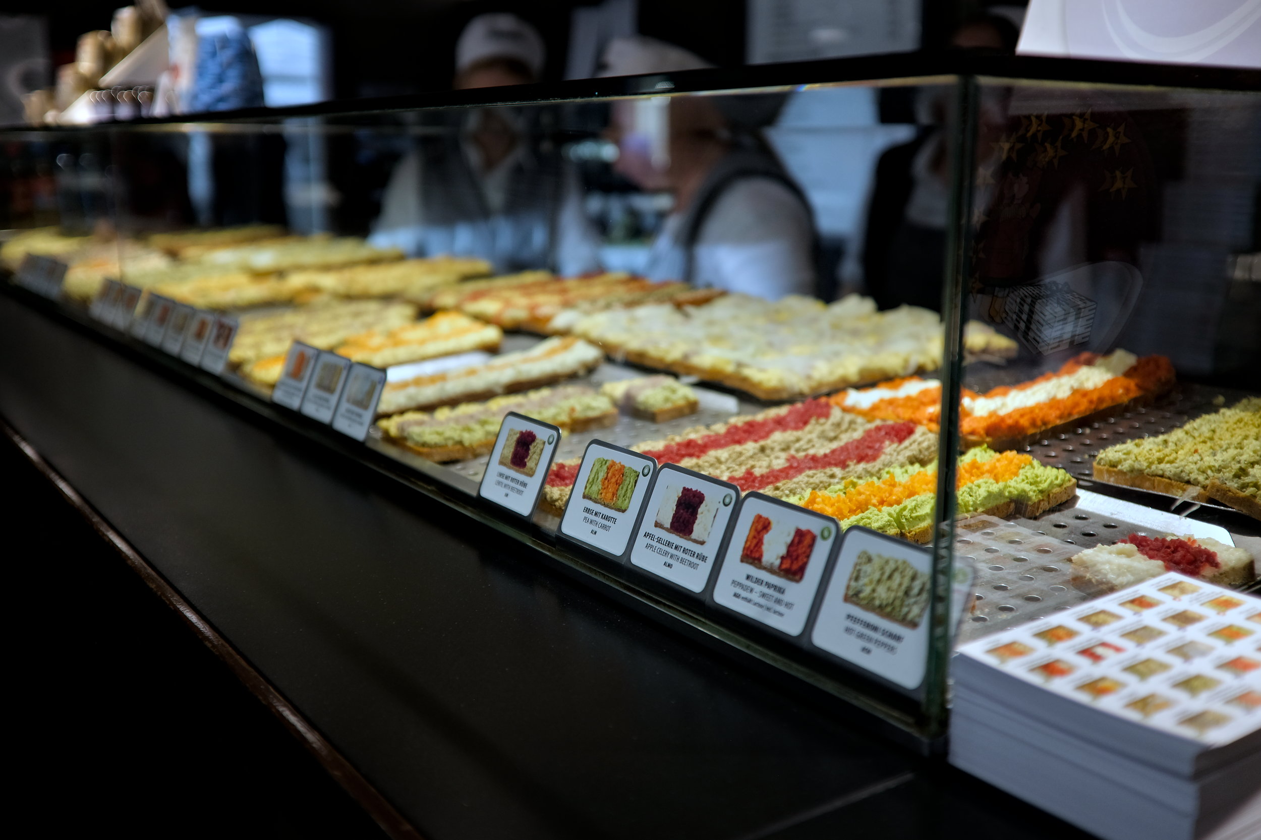 A selection of open-faced sandwiches in a case at Trzesniewski