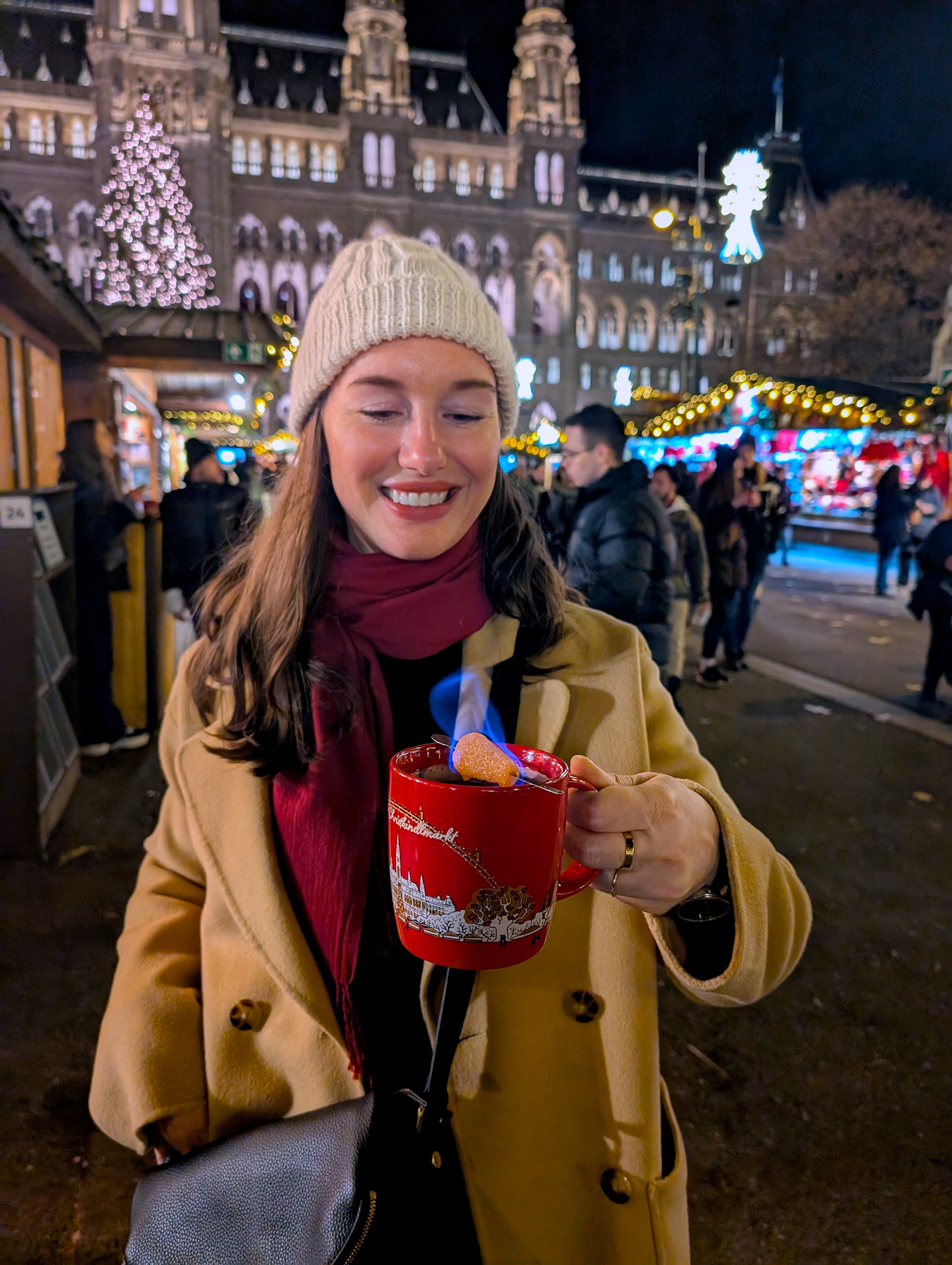 Alyssa holds a mug of fire tongs punch